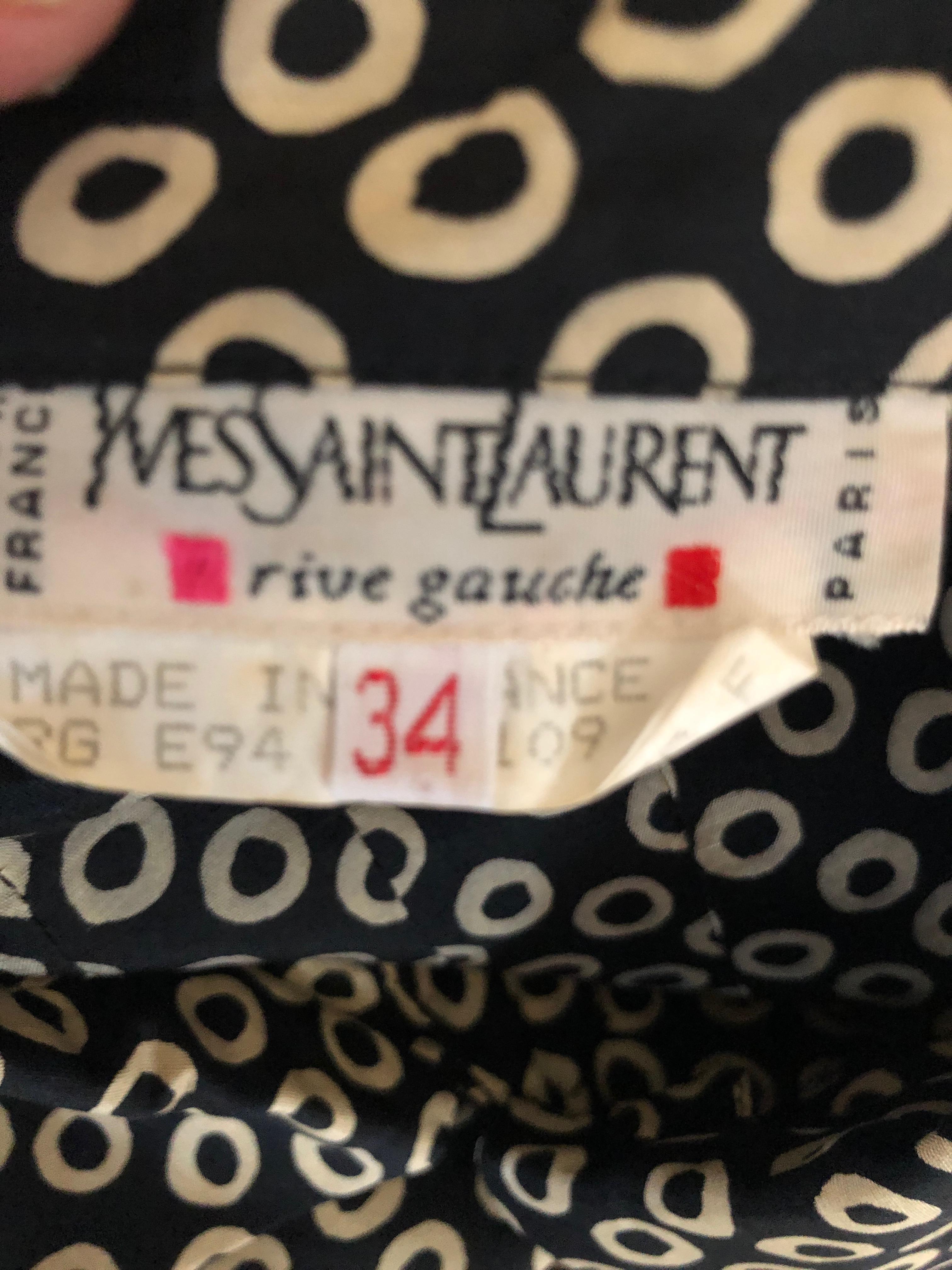 Yves Saint Laurent Rive Gauche Vintage 70's Silk Polka Dot Day Dress.
This is so charming with tie of puffed short sleeves.
Sz 34 , but seems to run large
Bust 38