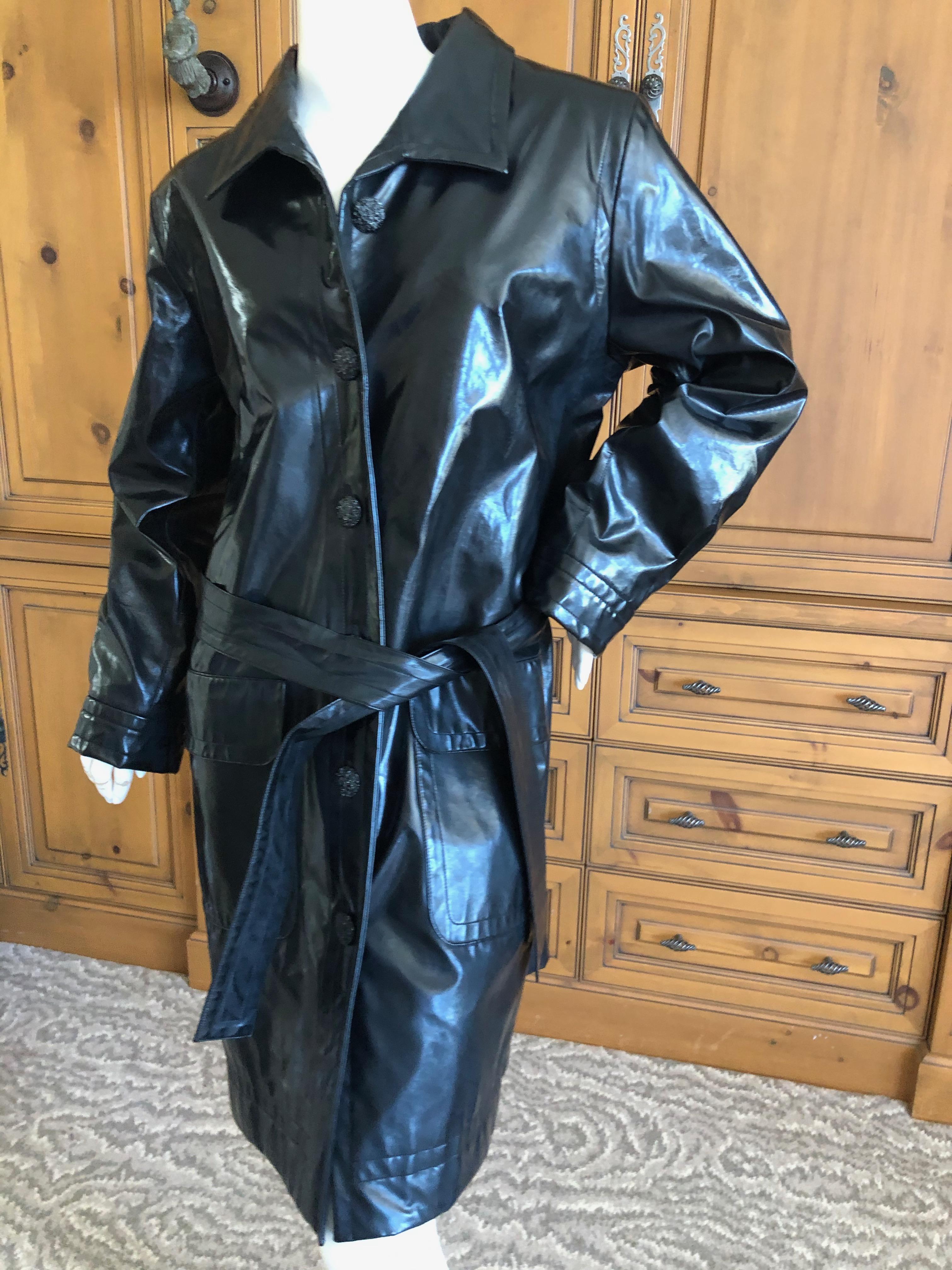 Yves Saint Laurent Rive Gauche Vintage Black Polished Cotton Trench Coat with Belt .
This looks like patent leather but is polished cotton so cool.
Sz 42
Bust 44