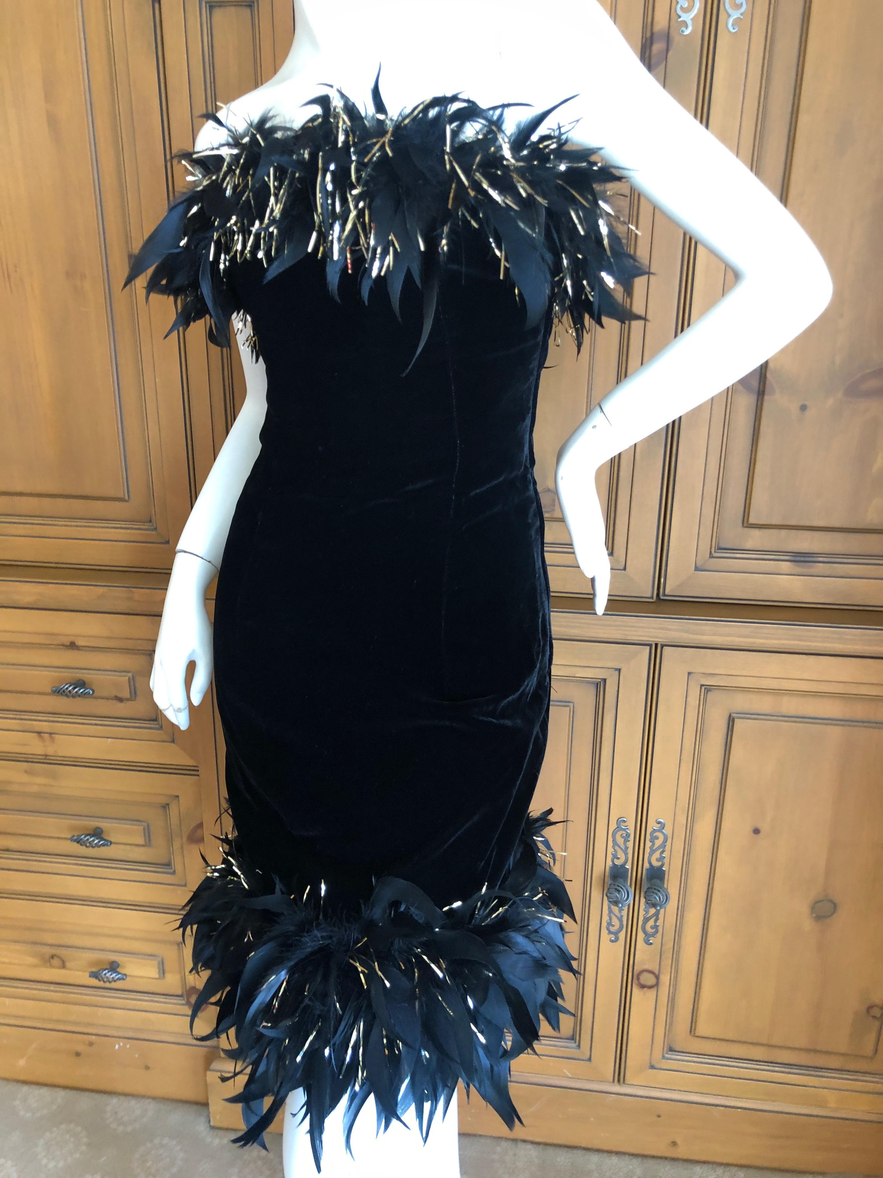 Yves Saint Laurent Rive Gauche Vintage Black Velvet Feather Trim Cocktail Dress
This is such a special piece, with a built in full corset with stays, and Coq feather and gold tinsel trim by Maison Lamaire,
Truly magnificent, in excellent