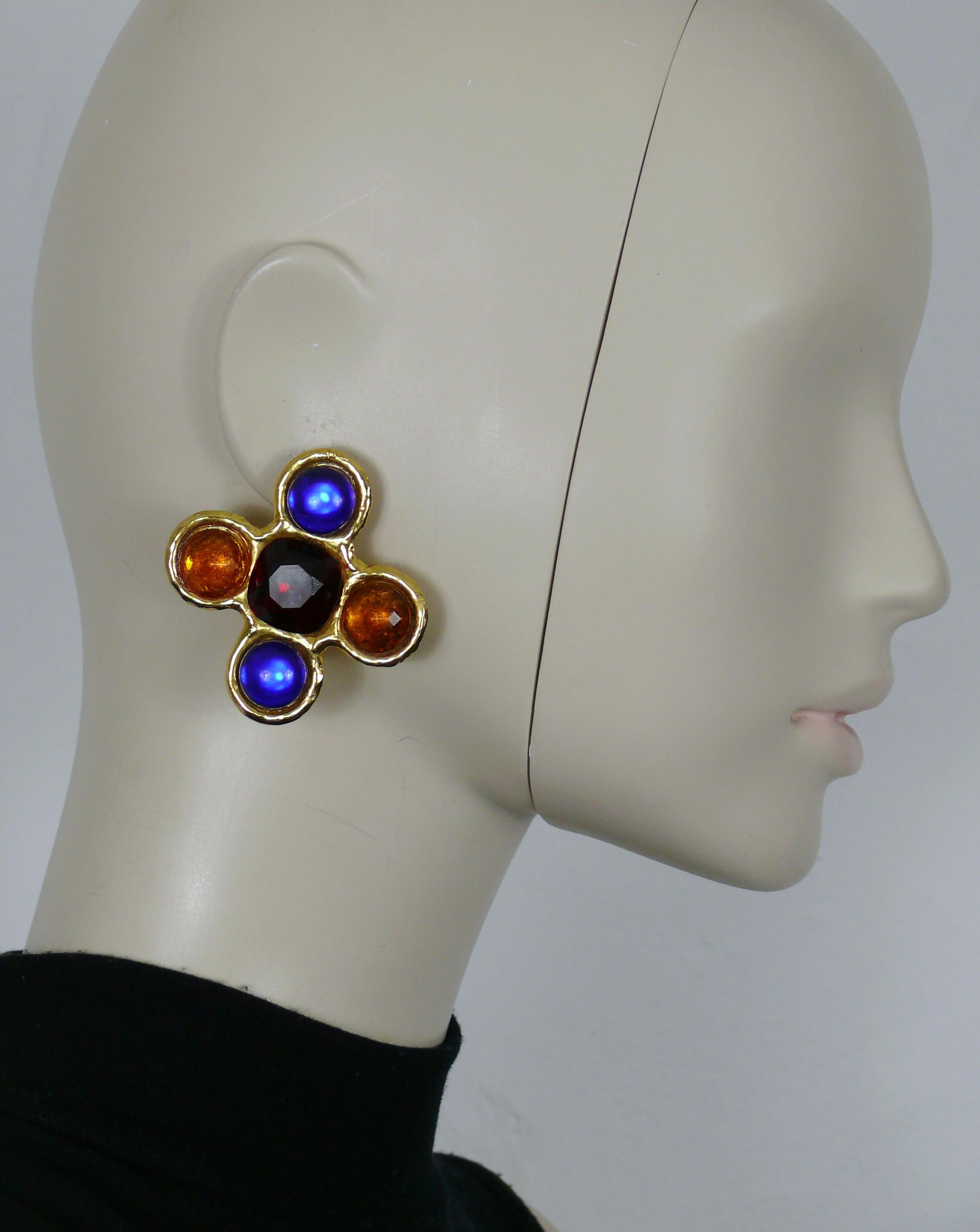 YVES SAINT LAURENT Rive Gauche vintage massive gold tone cross shape clip-on earrings embellished with blue glass cabochons, orange and red crystals.

Embossed YVES SAINT LAURENT Rive Gauche.
Made in France.

Indicative measurements : width approx.