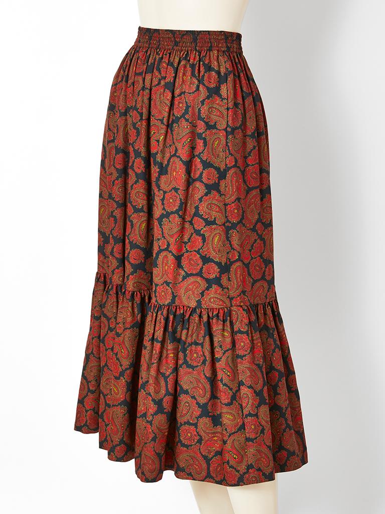 Yves Saint Laurent, Rive Gauche, paisley pattern, gathered, tiered, wool challis, peasant skirt, having an elastic waist and side hidden side pockets.