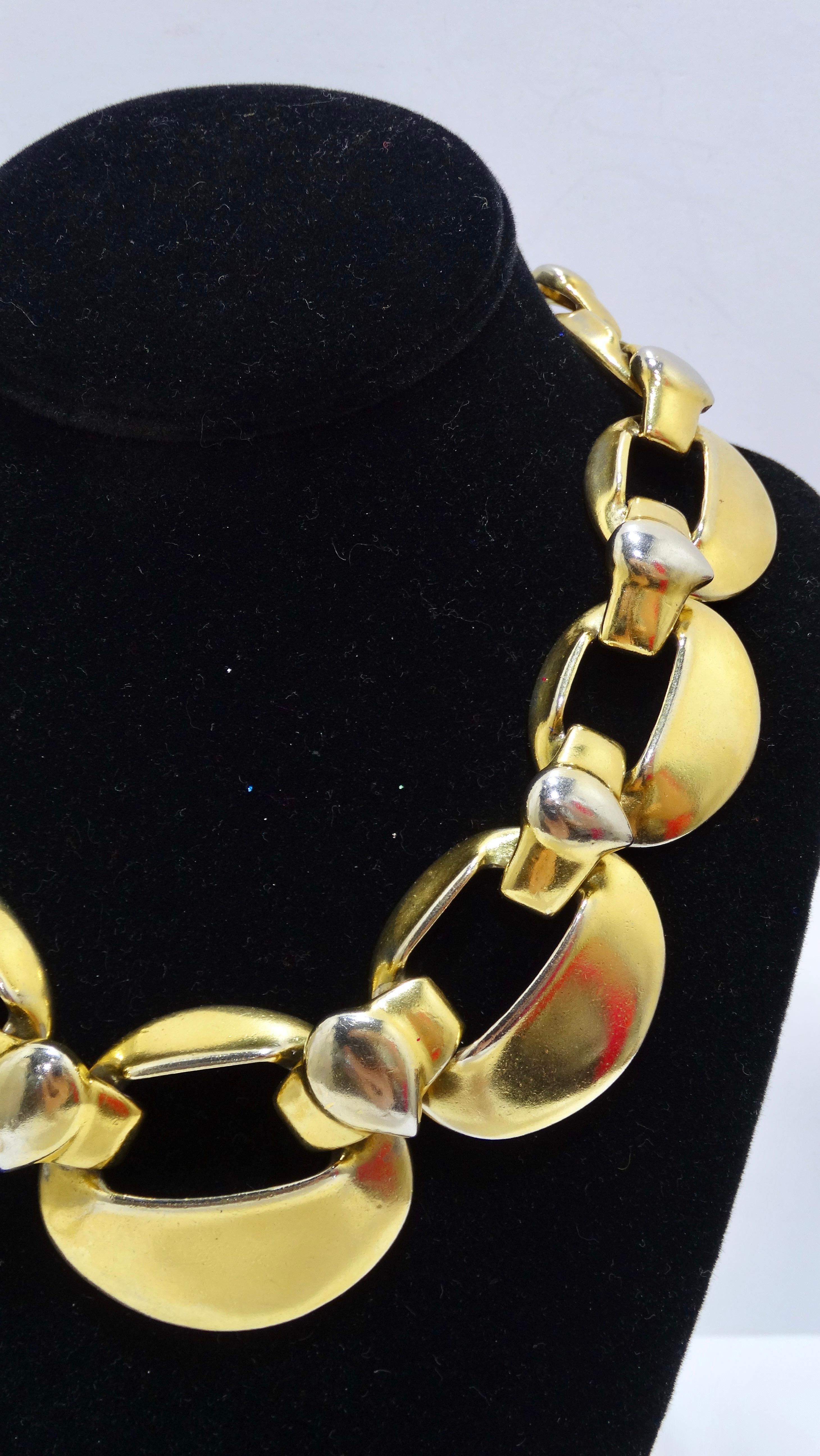 This is a bold yet beautiful runway piece from Yves Saint Laurent. Taken straight from the 80's, it is featured in a gold tone with 9 chunky links that sit close to the neck and a hook closure. Signed on the largest link. Light discoloration on the