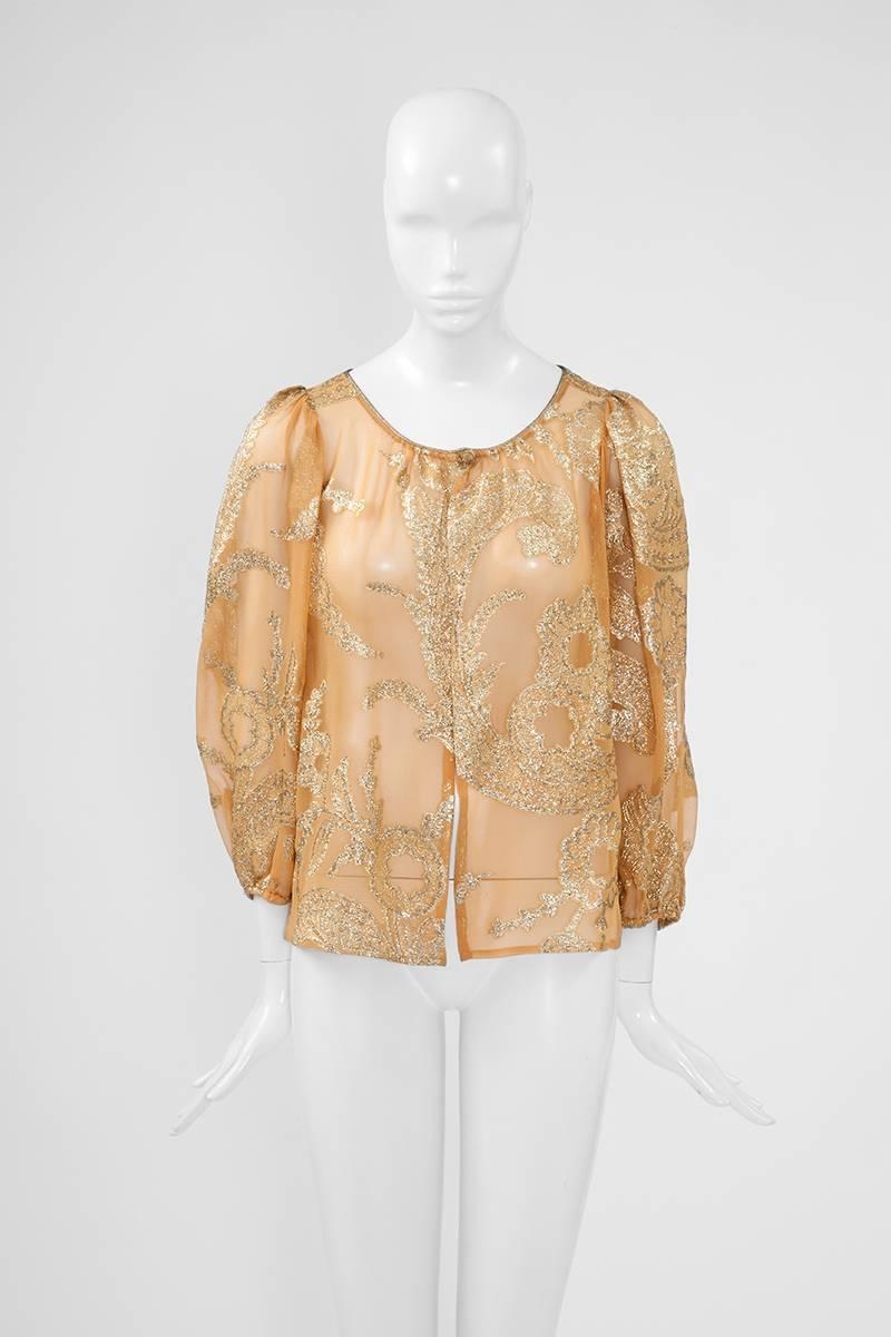 Documented (see picture 8) Yves Saint Laurent “Russian collection” yellow ochre silk chiffon cardigan top. Refined gold lurex floral motifs throughout this lightweight rare piece. Metallic gold braid around the edge neckline. Full elasticated