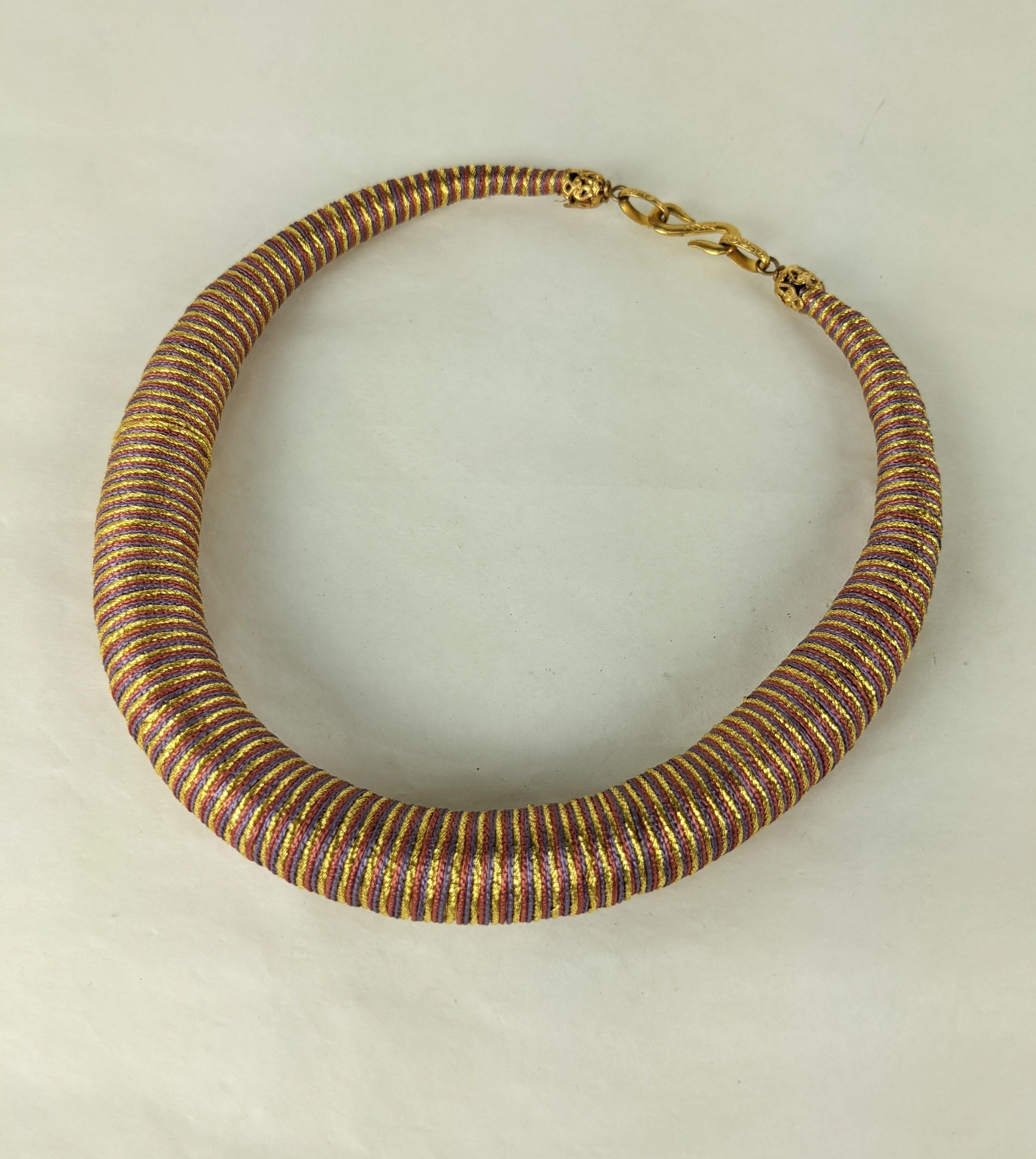 Rare Yves Saint Laurent  Russian Collection torque necklace from Fall-Winter 1976 Haute Couture collection. Deceptively constructed with a soft core tightly wrapped gold metallic, deep rasberry and lavender silk soutache passementerie cord,