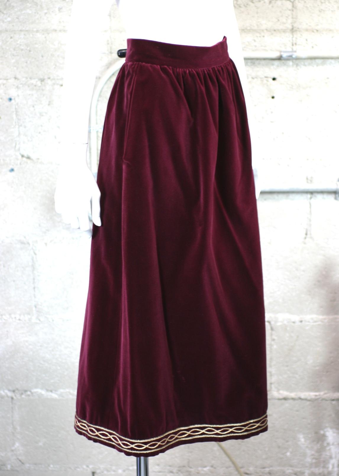 Yves Saint Laurent Russian Collection Skirt in a soft, silky wine cotton/rayon blend. Simply constructed with gathered waist and gold soutache embroidery along hem. Fully lined.
YSL Rive Gauche. Side zip closure with 2 pockets.
Waist 28