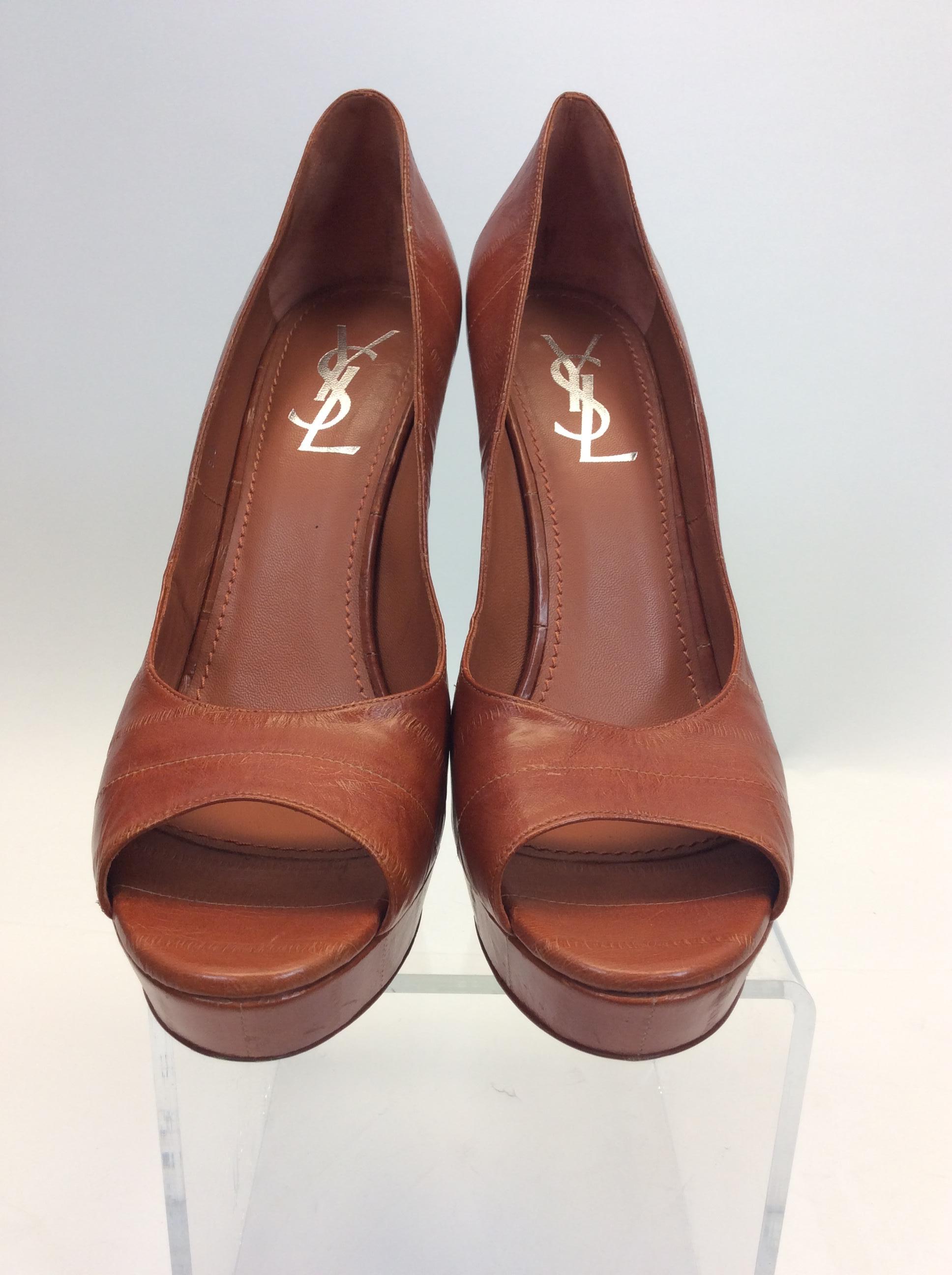 Yves Saint Laurent Rust Orange Leather Peep Toe Pumps
$250
Made in Italy
Leather
Size 40
1” platform
5.75” heel