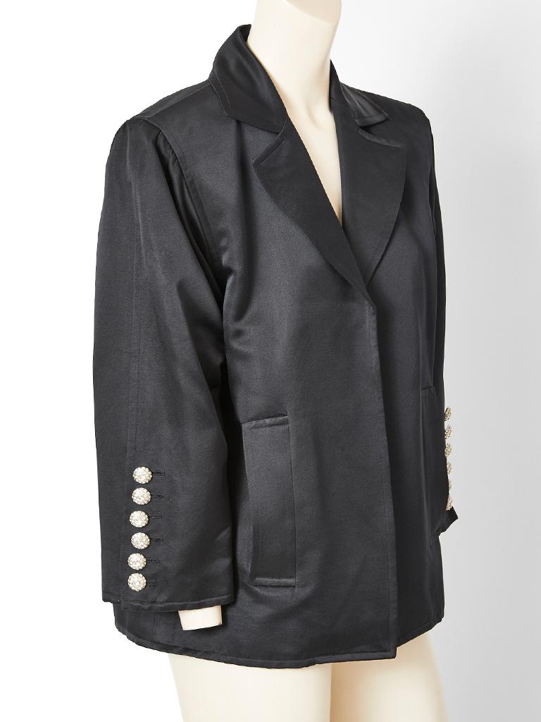 Yves Saint Laurent, Rive Gauche, black, satin, box cut, oversize blazer/evening jacket, having a notched collar, vertical placed side pockets, and diamanté button detail at the cuffs.