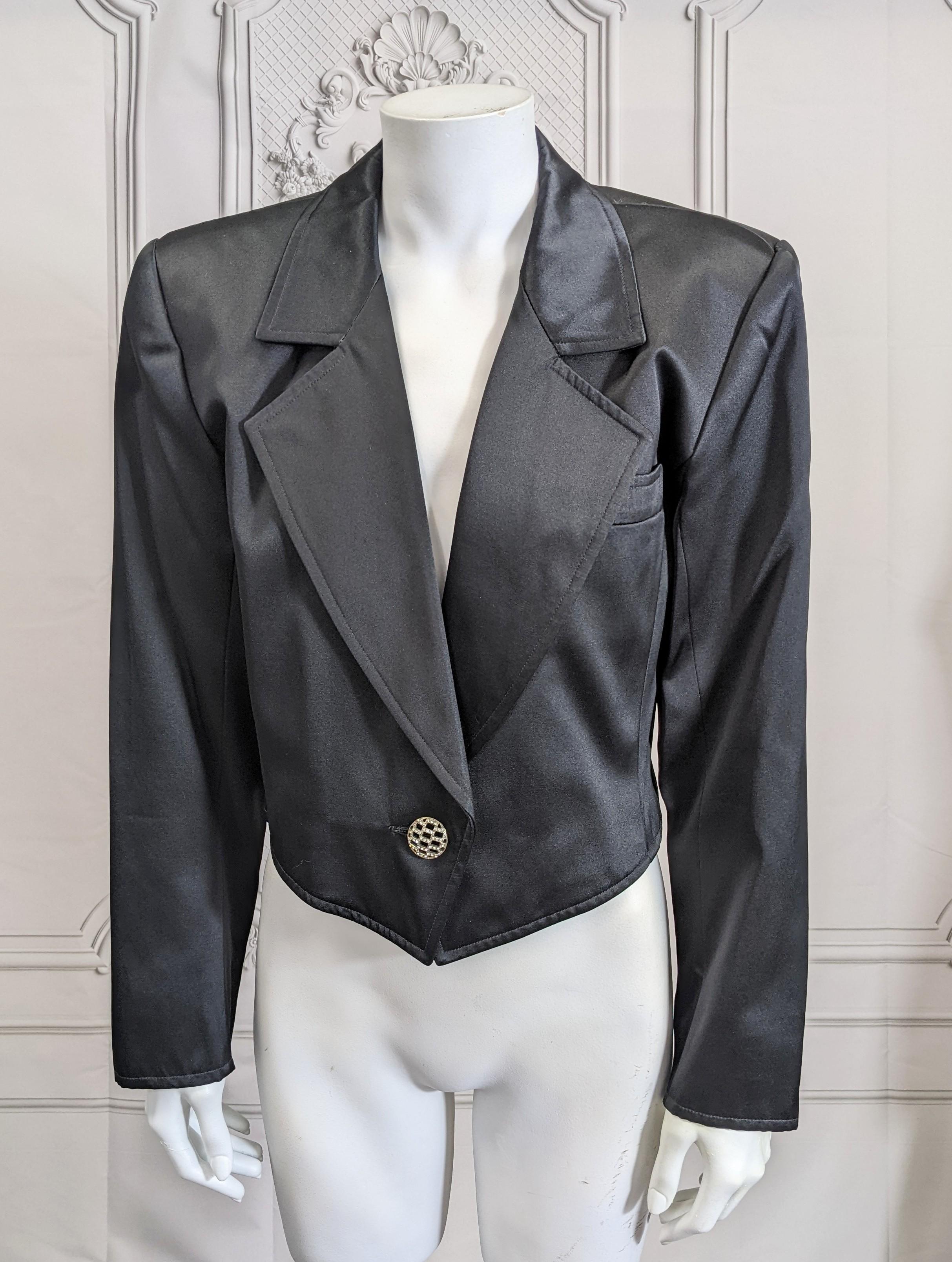 Iconic Yves Saint Laurent Satin Spencer Tuxedo Jacket from the 1980's with crystal decorated buttons at waist and cuffs. Super strong shoulders with tapered cropped cut in satin. Size 38. France 1980's. 
