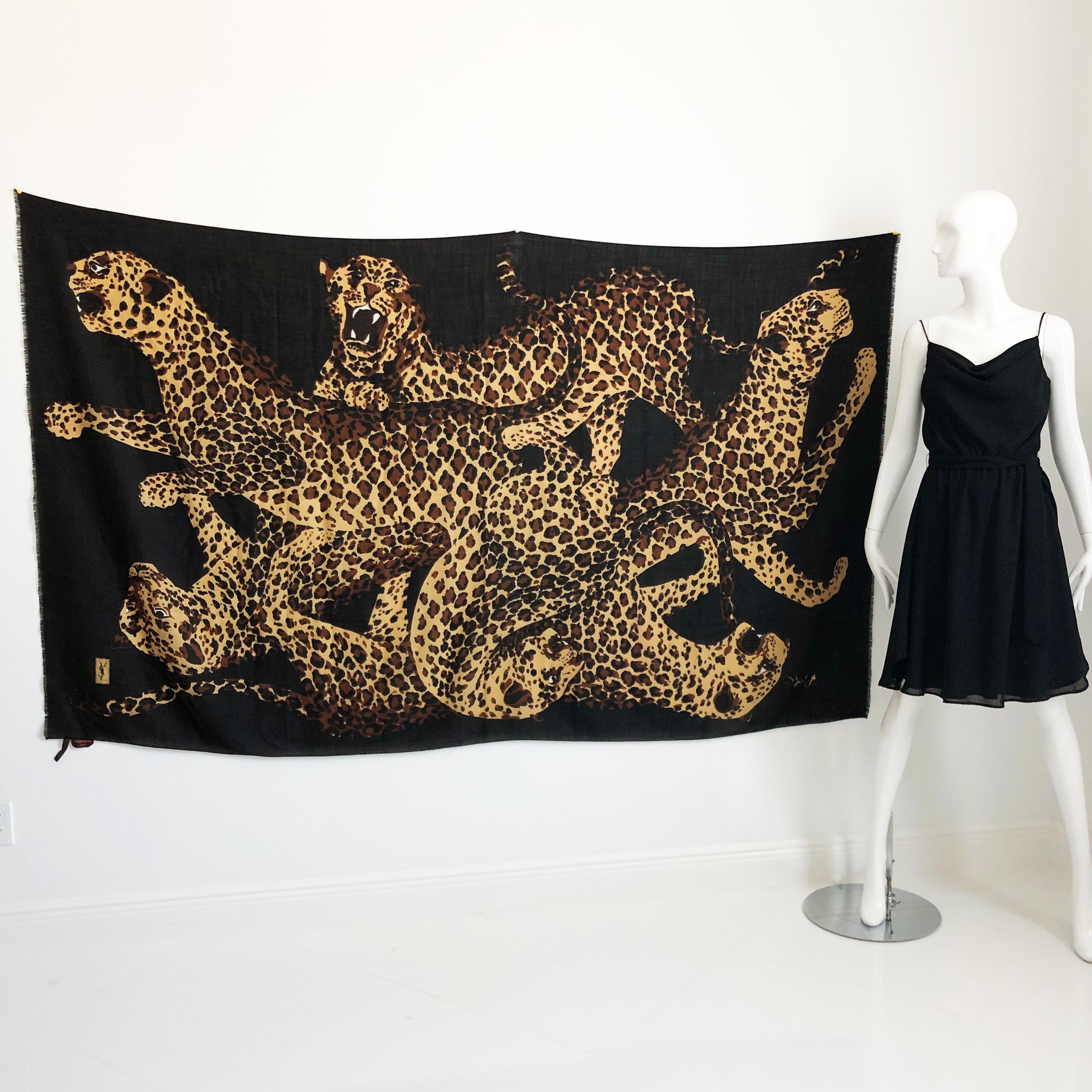 Authentic, preowned and incredibly rare Yves Saint Laurent Massive 84in L x 78in H Leopards shawl or scarf.  Perfect for wear as a pareo or shawl (or even for use as an outstanding wall decoration).  Fringed edges on two sides, with YSL logo on