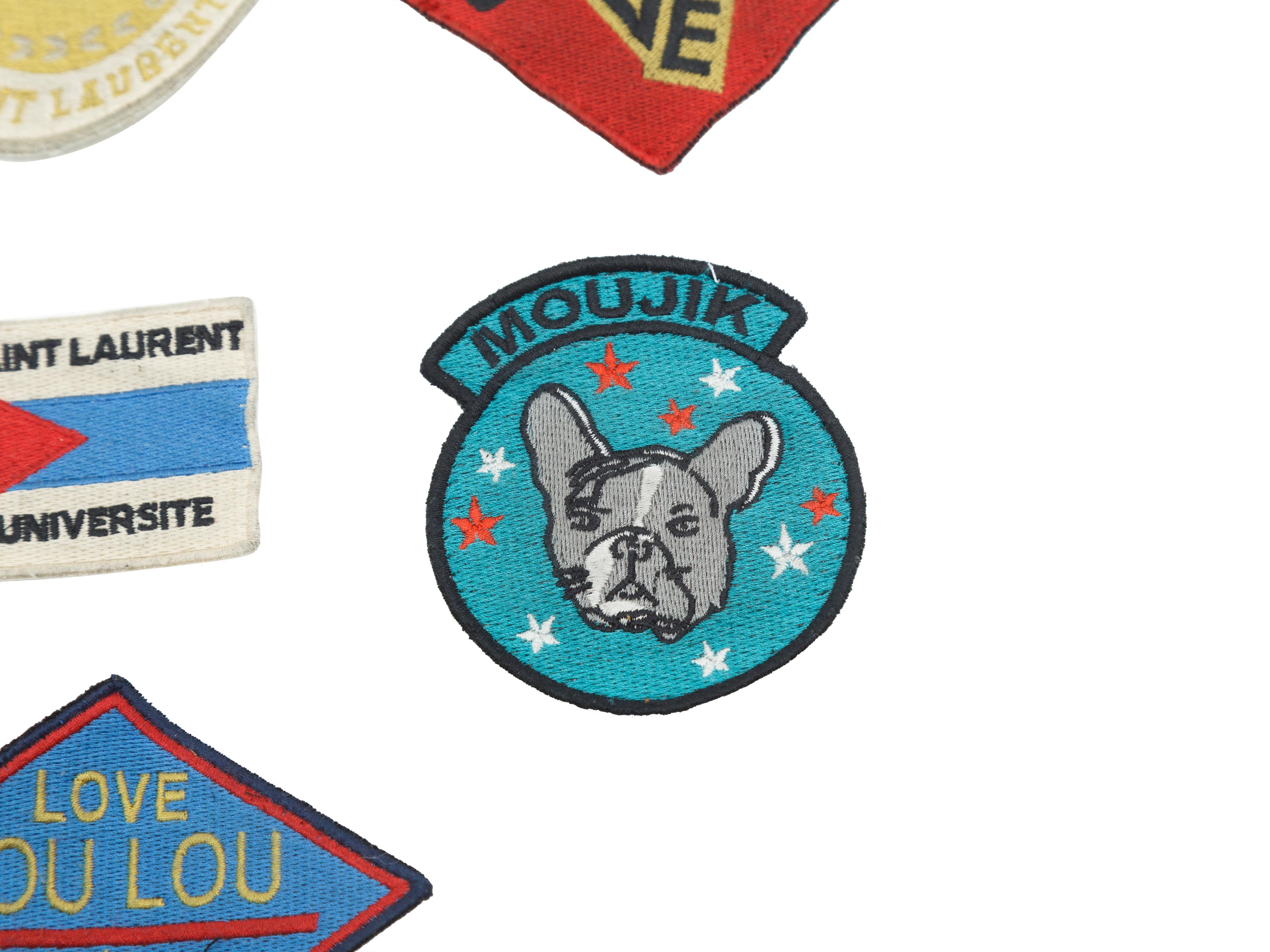 Product details:  Set of 7 assorted multicolor patches by Yves Saint Laurent. 
Condition: Pre-owned. Very good.