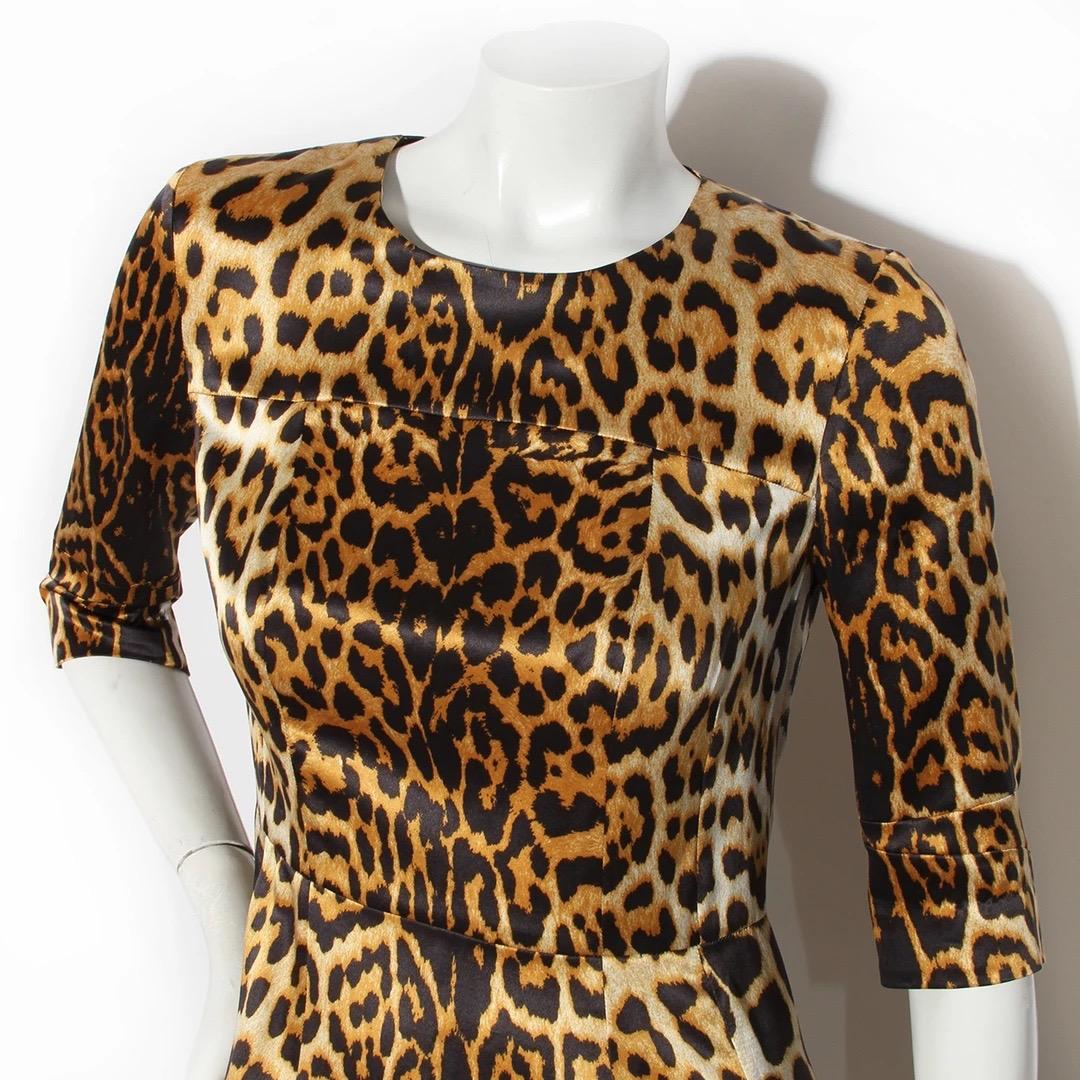 Yves Saint Laurent by Stefano Pilati Dress
Made in Italy 
Produced in 2011
Leopard print 
Open neckline 
Fitted sheath dress 
Three quarter sleeve 
Back of skirt has small vent
Fabric Composition; 100% Silk
Excellent condition; Preloved with no