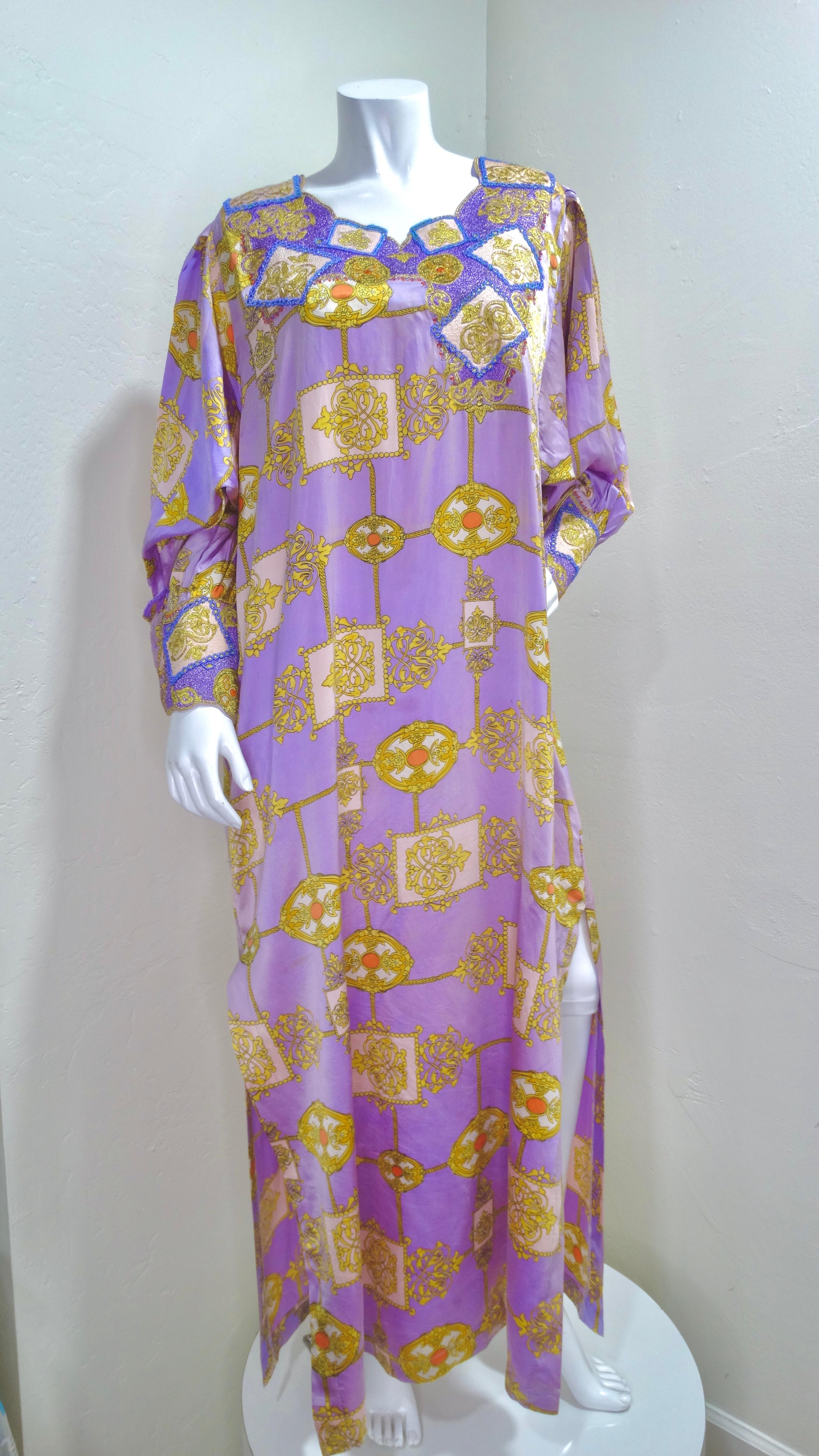 This is a mid-century gem! This Yves Saint Laurent gown has details upon details. The most remarkable being the intricate beaded creating a pattern around the round neckline and the cuffs on the arm. A soft purple is accompanied by a gold frame