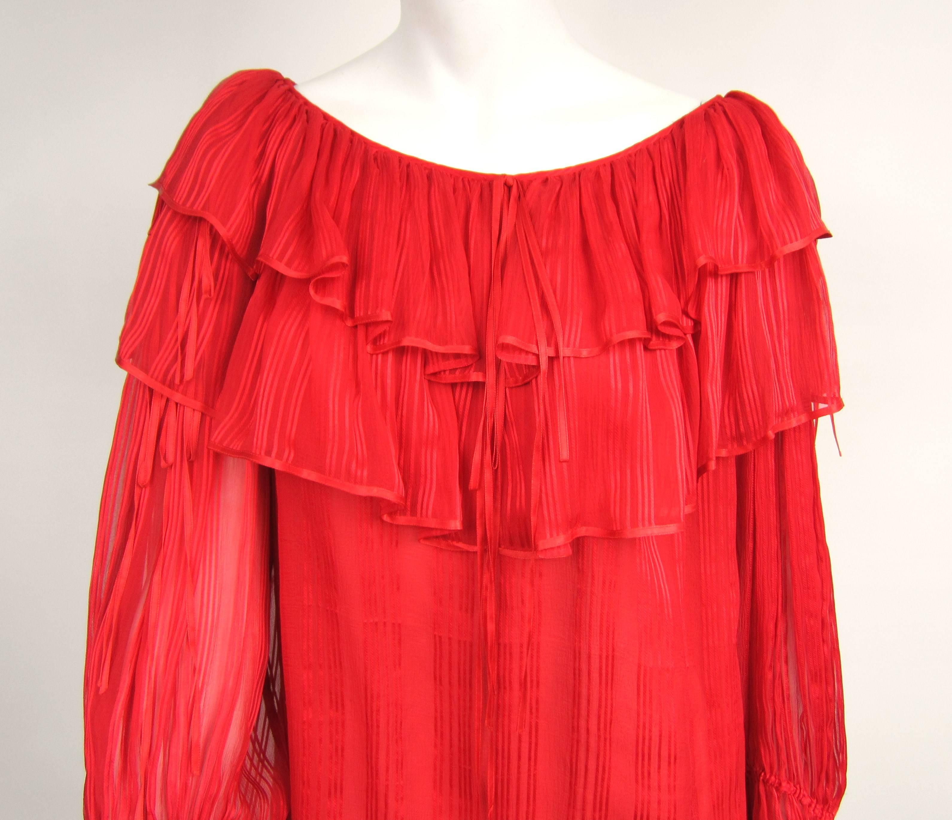 Stunning Red Ruffled YSL Silk Top Russian Collection 1976. Numbered 41163 Yves Saint Laurent Paris Double Ruffles on this amazing piece of YSL history! Large oversized bell cuff sleeves. Ribbons accent the shirt Measuring - Up to 38 bust -Waist open