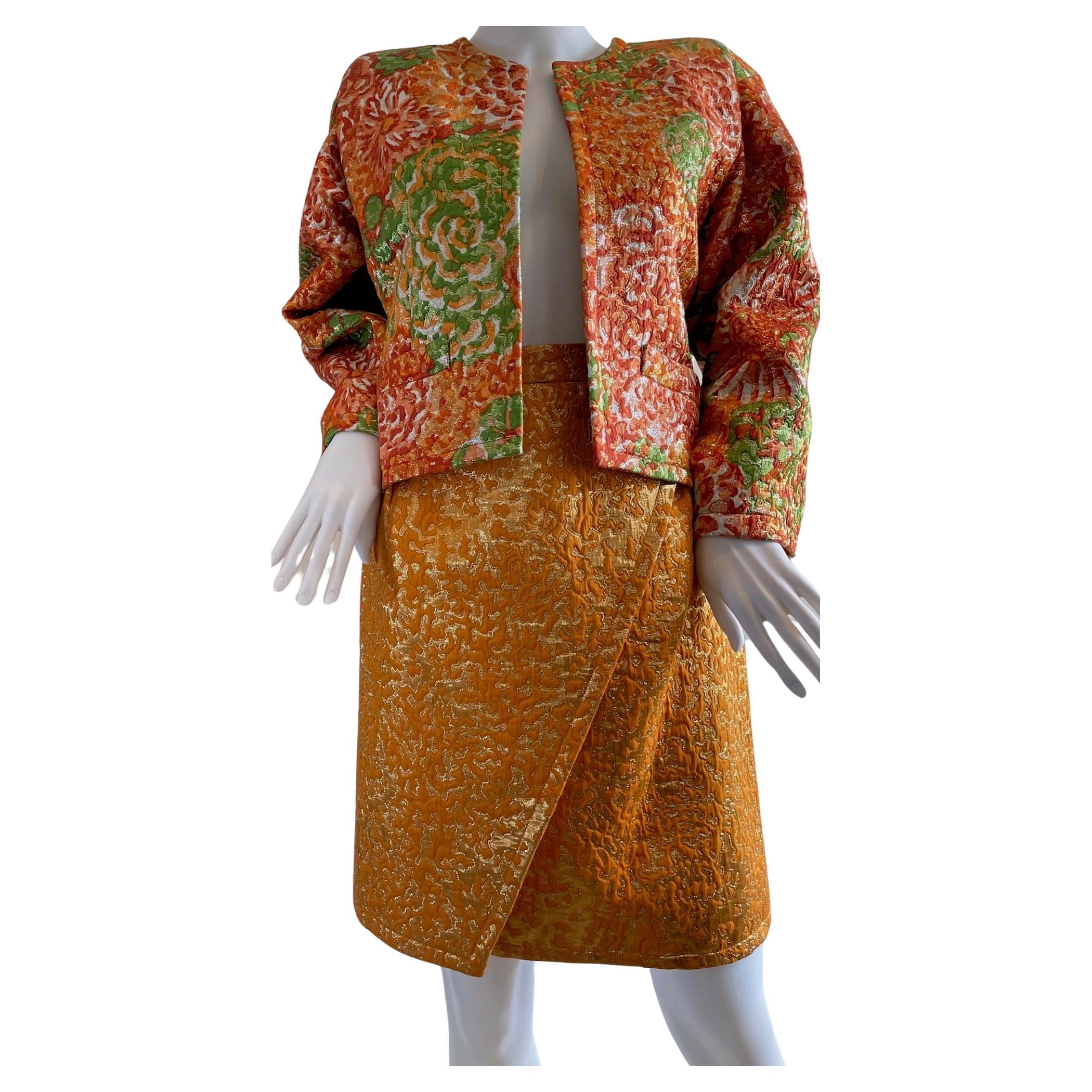 This is an amazing vintage RARE Yves Saint Laurent Collection Runway 1989 - very rare to find the complete suit from this collection. 

This YSL suit is luxuriously handcrafted with multi colour lamé floral brocade in tangerine, gold, green,
