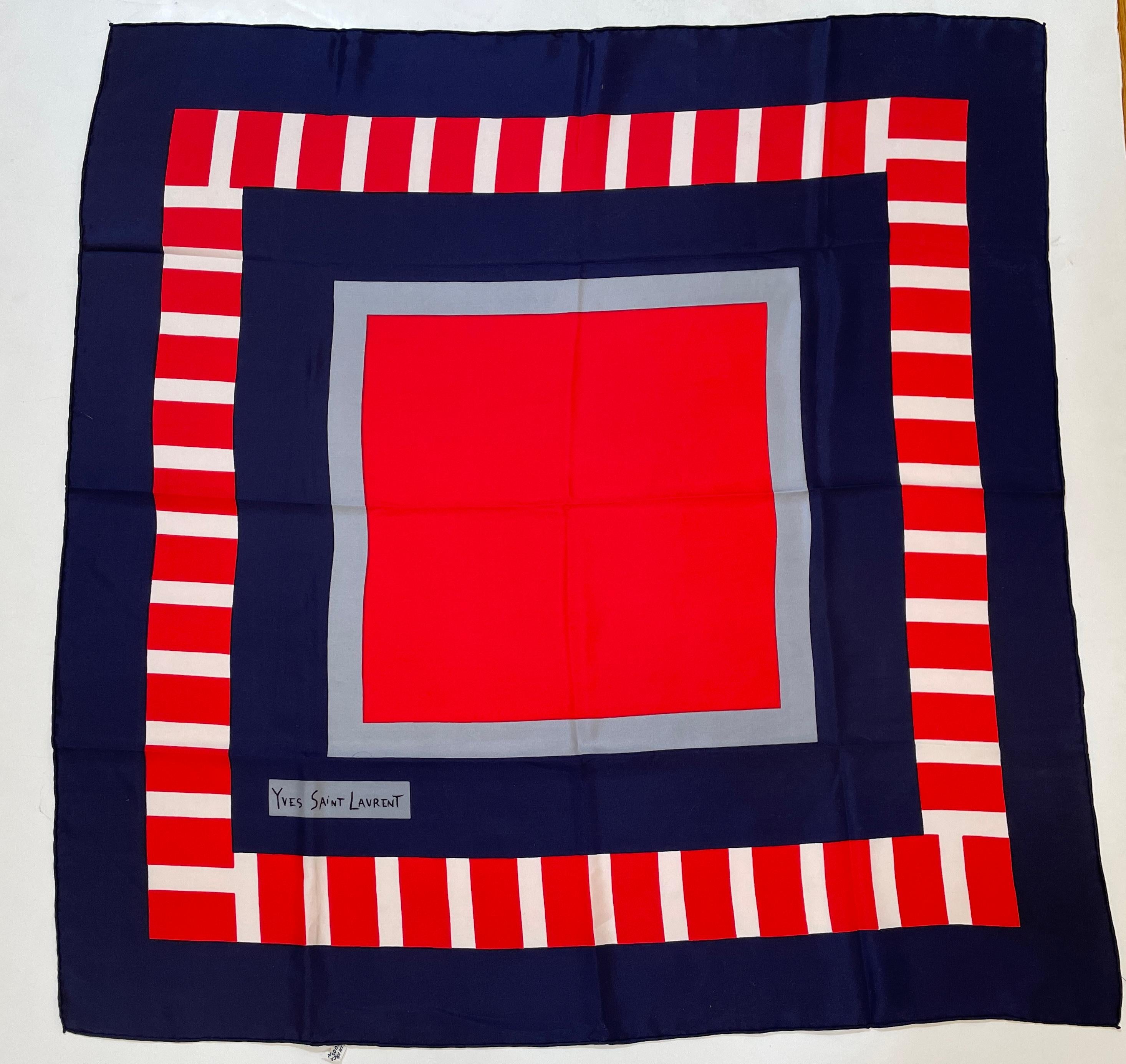 Yves Saint Laurent Bold Silk Crepe de Chine Multi-Color Abstract Scarf 1980s.
Yves Saint Laurent wonderful bold multi-color bold abstract silk crepe de chine scarf.
Mondrian style post modern, blue red and gray geometric squares and line in red and