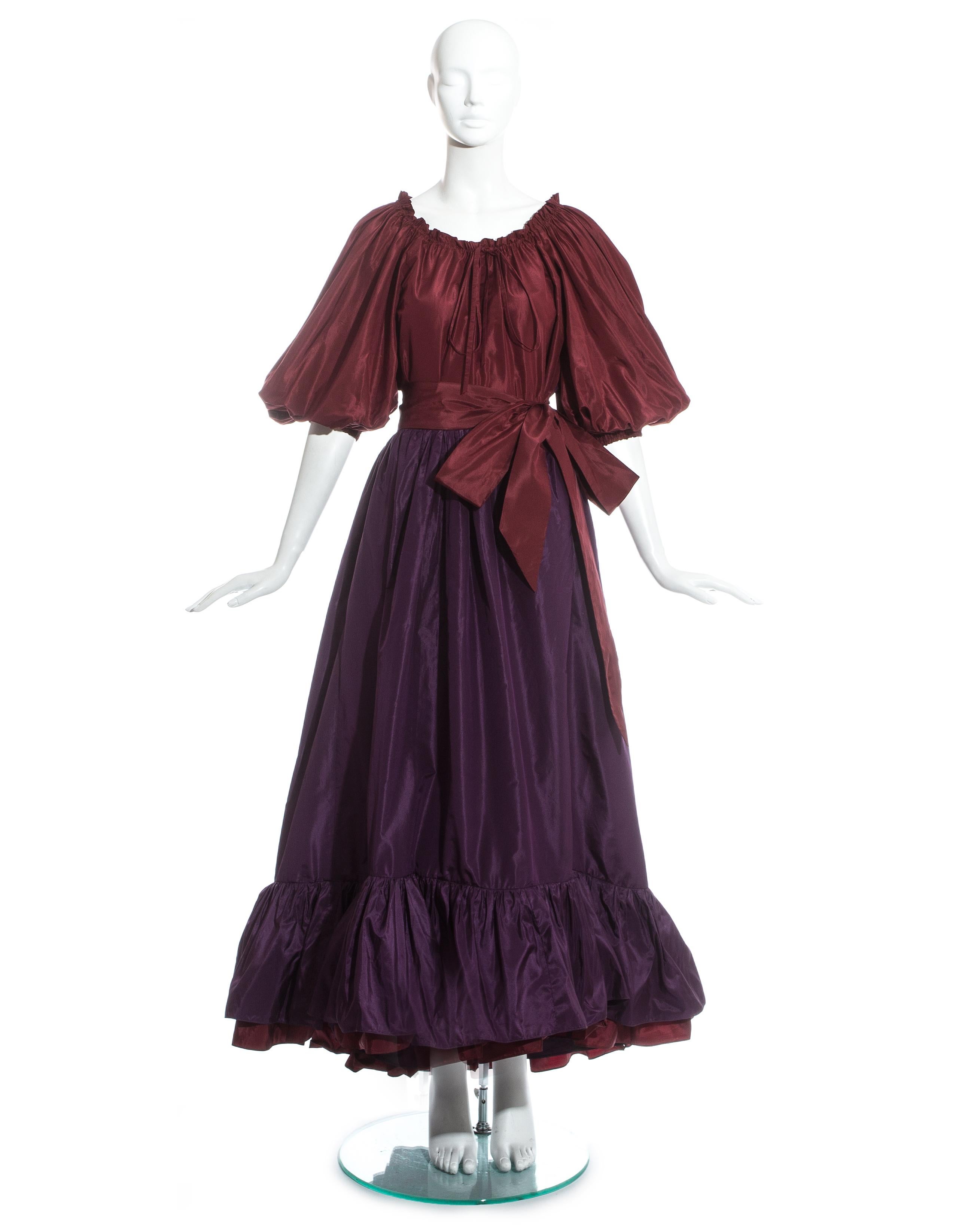 Yves Saint Laurent silk taffeta plum blouse and skirt evening ensemble. Blouse with drawstring collar, bow fastening, and balloon sleeves with elasticated cuff.  High waisted tiered plum skirt fastening with a long ribbon, pleated under skirt and