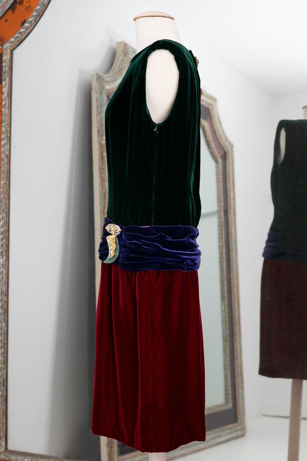 Yves Saint Laurent Haute Couture Silk velvet dress with drop waist, embellished with a jewel made of rock crystal, jadeite ad ormoulu. Ribbon N°67412. Collection Haute couture 1990/91. 
No composition or size tag, it fits a size 38FR.

Additional