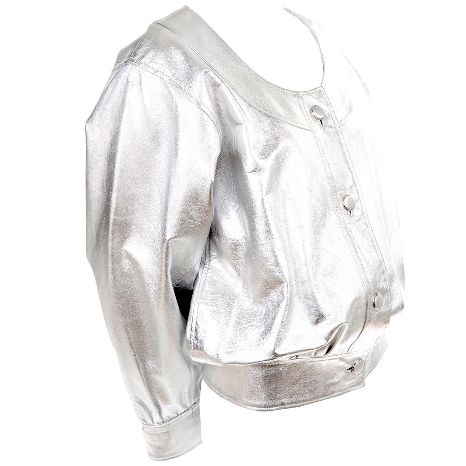This is an outstanding vintage jacket from Yves Saint Laurent in a beautiful silver leather. This gorgeous YSL jacket has front buttons, oversized sleeves, a scoop neck and it is fully lined.  The jacket is meant to be worn oversized and is labeled