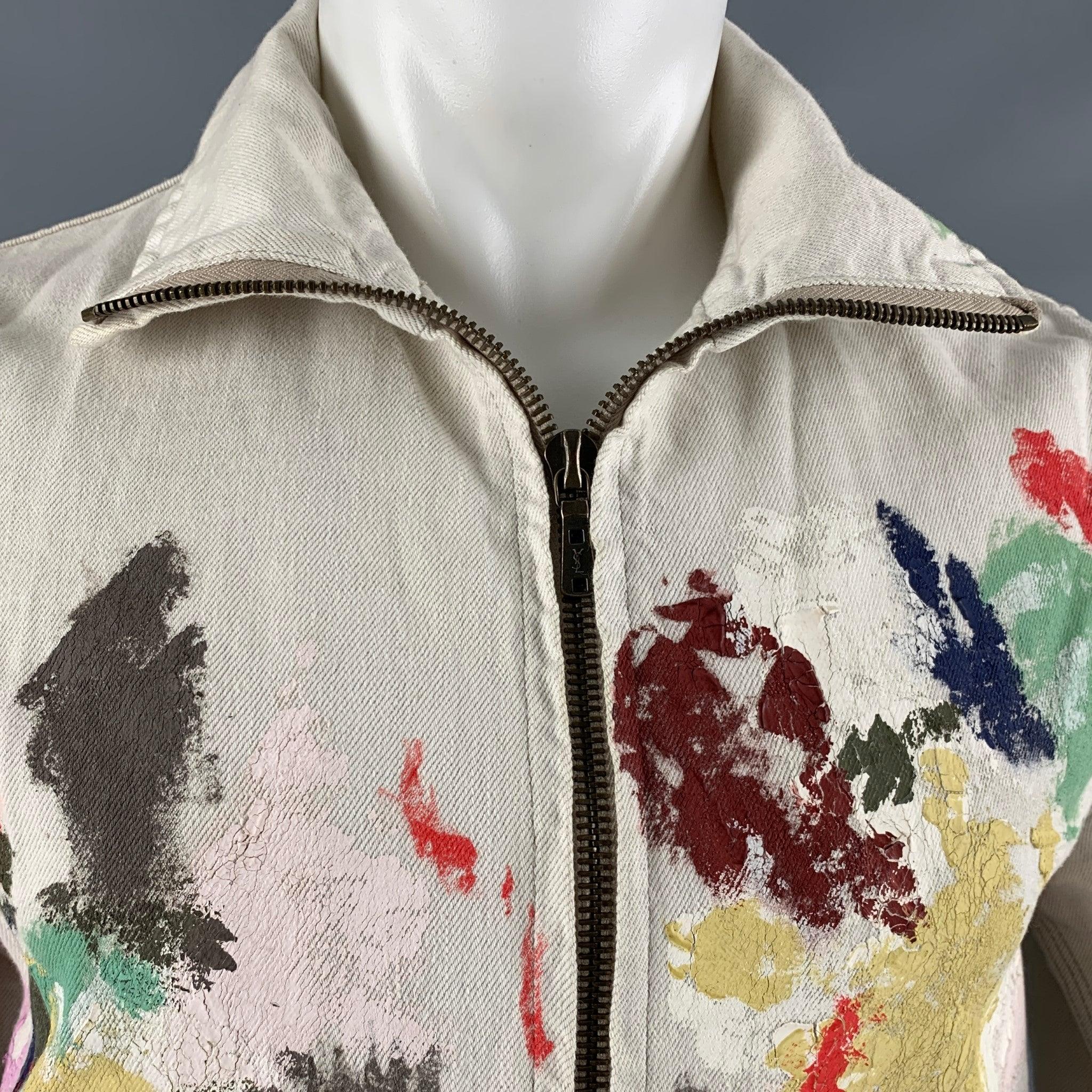 YVES SAINT LAURENT 2007 jacket comes in a white cotton canvas featuring a
 large pockets multi- colour splattered details, and zip up closure. Made in Japan.Very Good Pre- Owned Conditions. Moderate signs of wear.
As Is. 

Marked:   46
