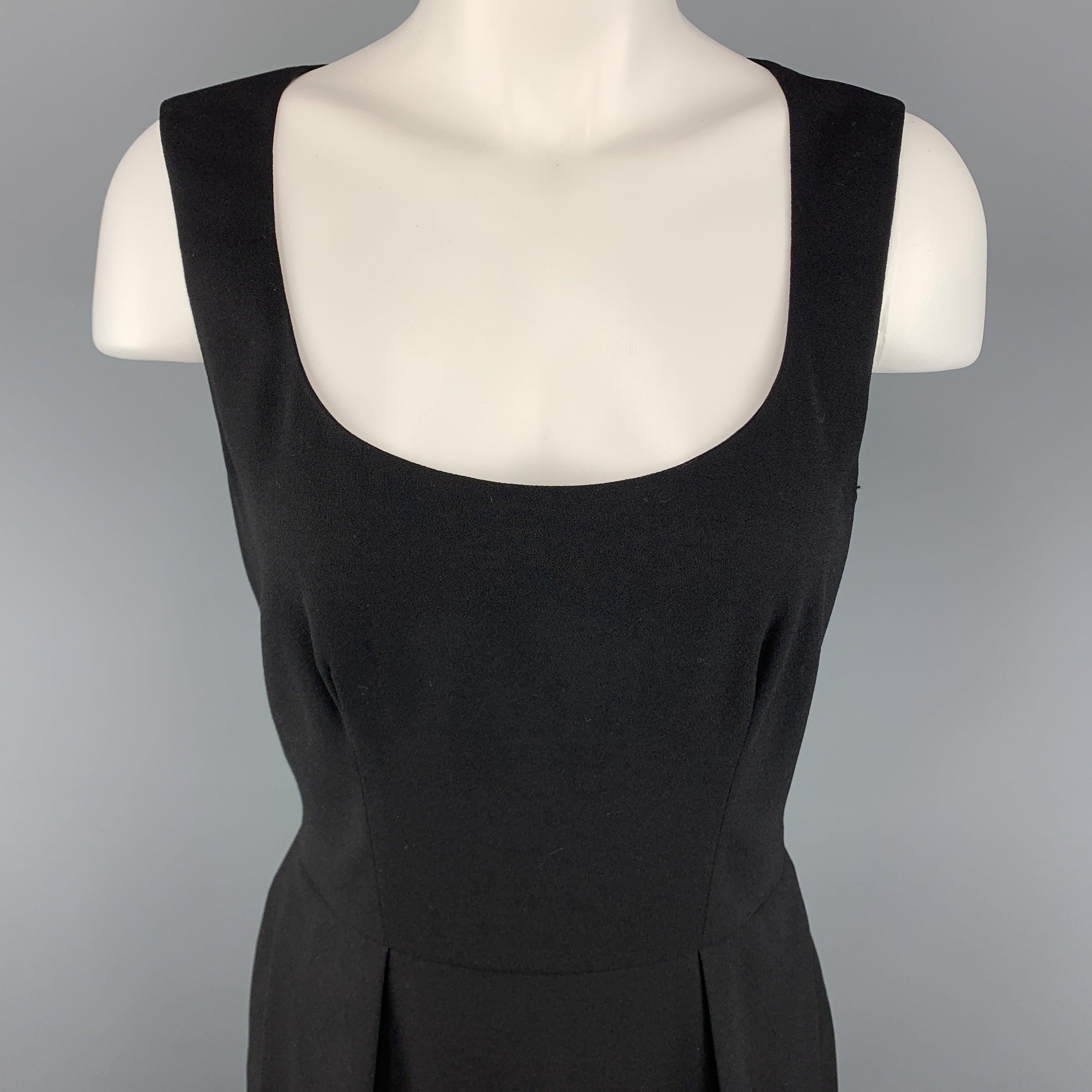 YVES SAINT LAURENT Shift Dress comes in a black tone in a solid wool / elastane material, 
with a pleated front at skirt, side pockets, sleeveless. Made in Italy.
Excellent Pre-Owned Condition.
 

Marked:   FR 
38
 

Measurements: 
  
lShoulder: