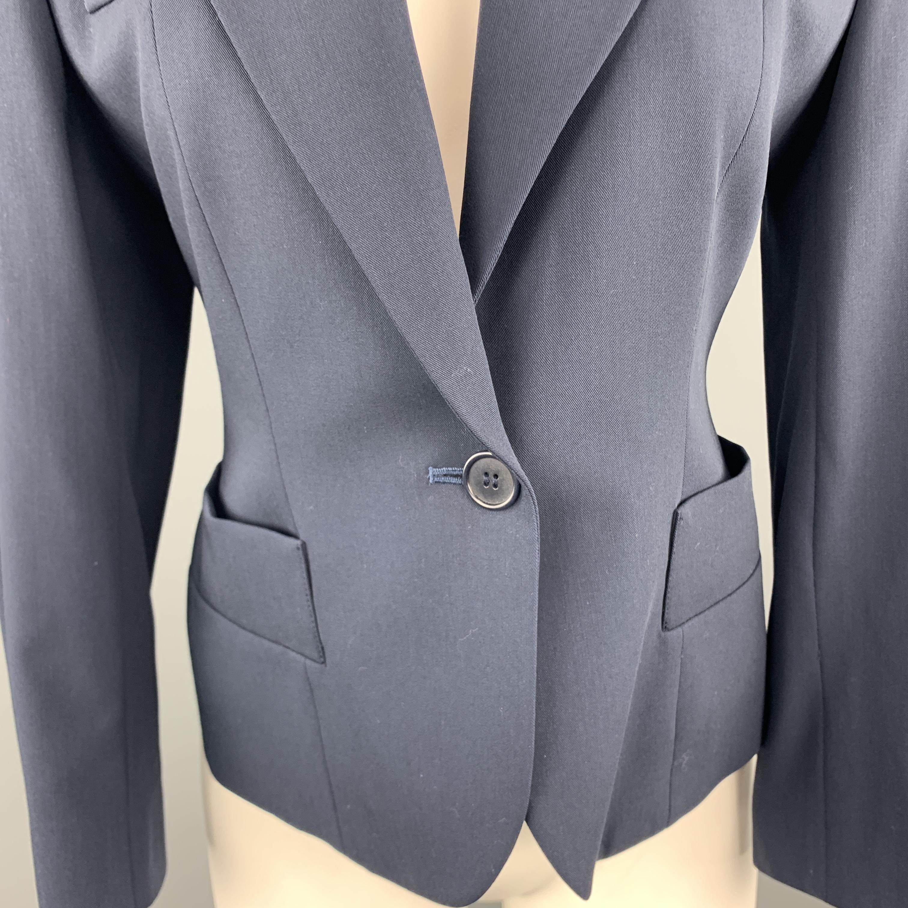Vintage YVES SAINT LAURENT VARIATIONS blazer comes in navy blue virgin wool with a strong shoulder pocket details, and cropped hem. Made in France.
 
Excellent Pre-Owned Condition.
Marked: FR 38 / 6
 
Measurements:
 
Shoulder: 16 in.
Bust: 36