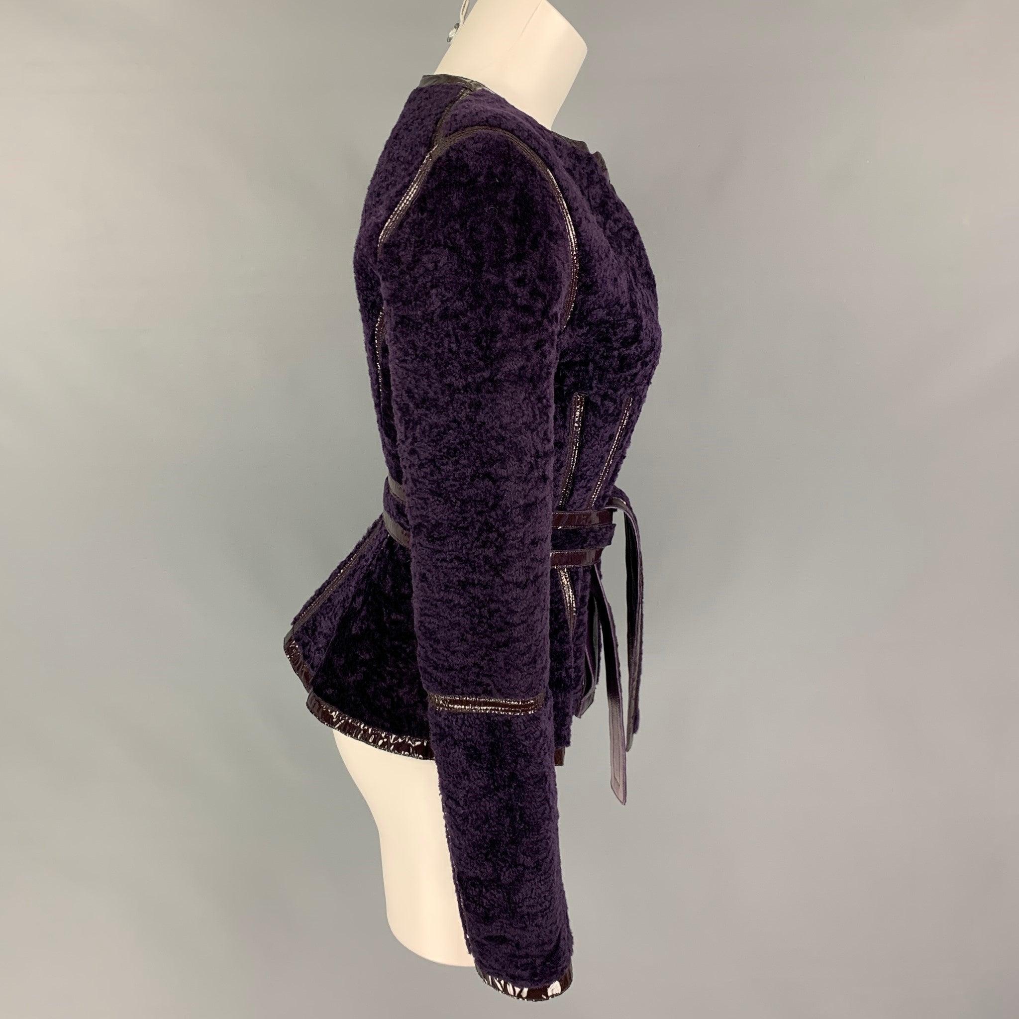 YVES SAINT LAURENT jacket comes in a purple shearling featuring a reversible leather design, patent leather trim, belted, and a buttoned closure.
New with tags.
 

Marked:   F 38  

Measurements: 
 
Shoulder: 15.5 inches  Bust: 34 inches  Sleeve: