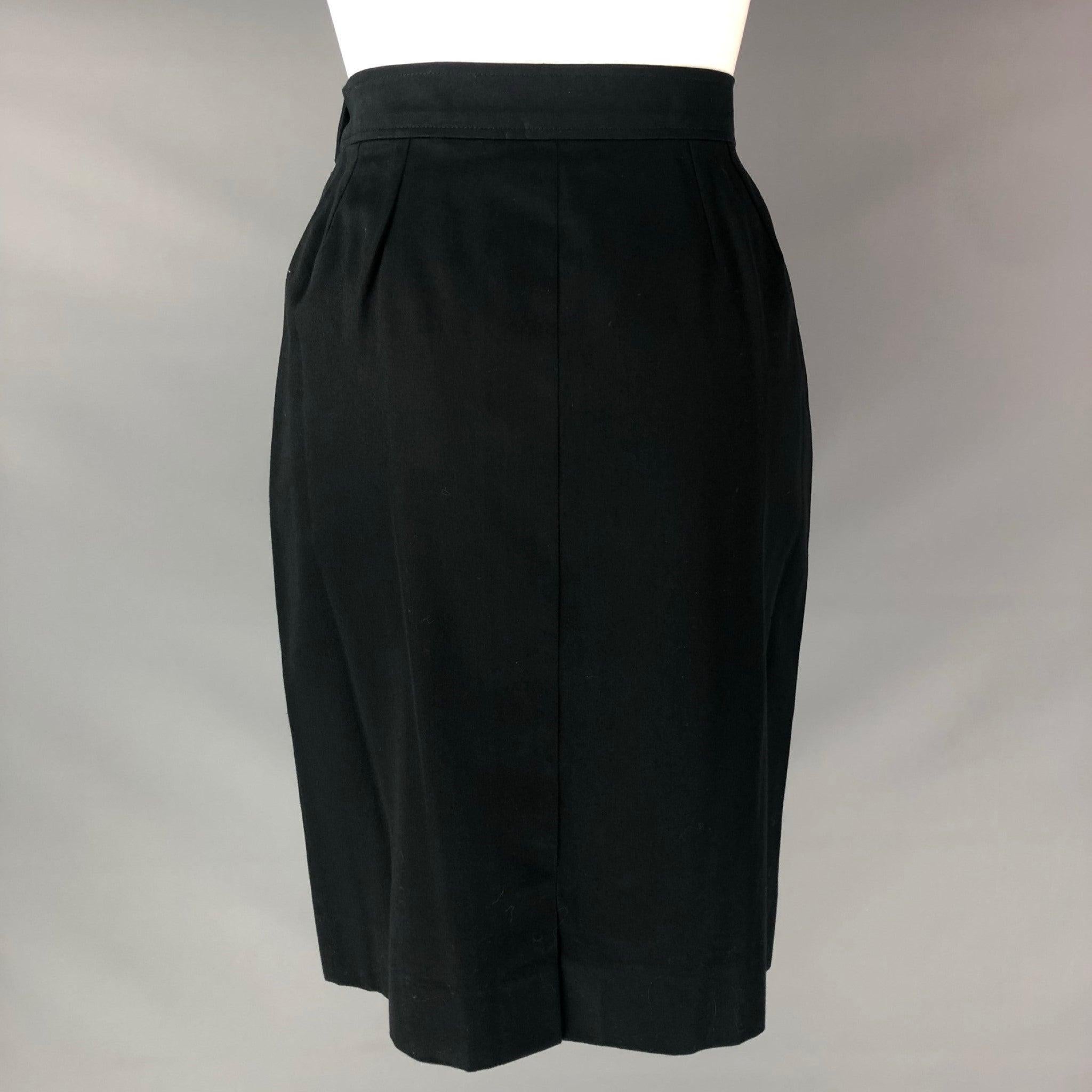 YVES SAINT LAURENT below knee pencil skirt comes in a black cotton featuring side invisible Zip and button closure and Flat Front. Made in France. Excellent Pre-Owned Condition.  
 

 Marked:  40 IT 
 

 Measurements: 
  Waist: 28 inHip: 36 in