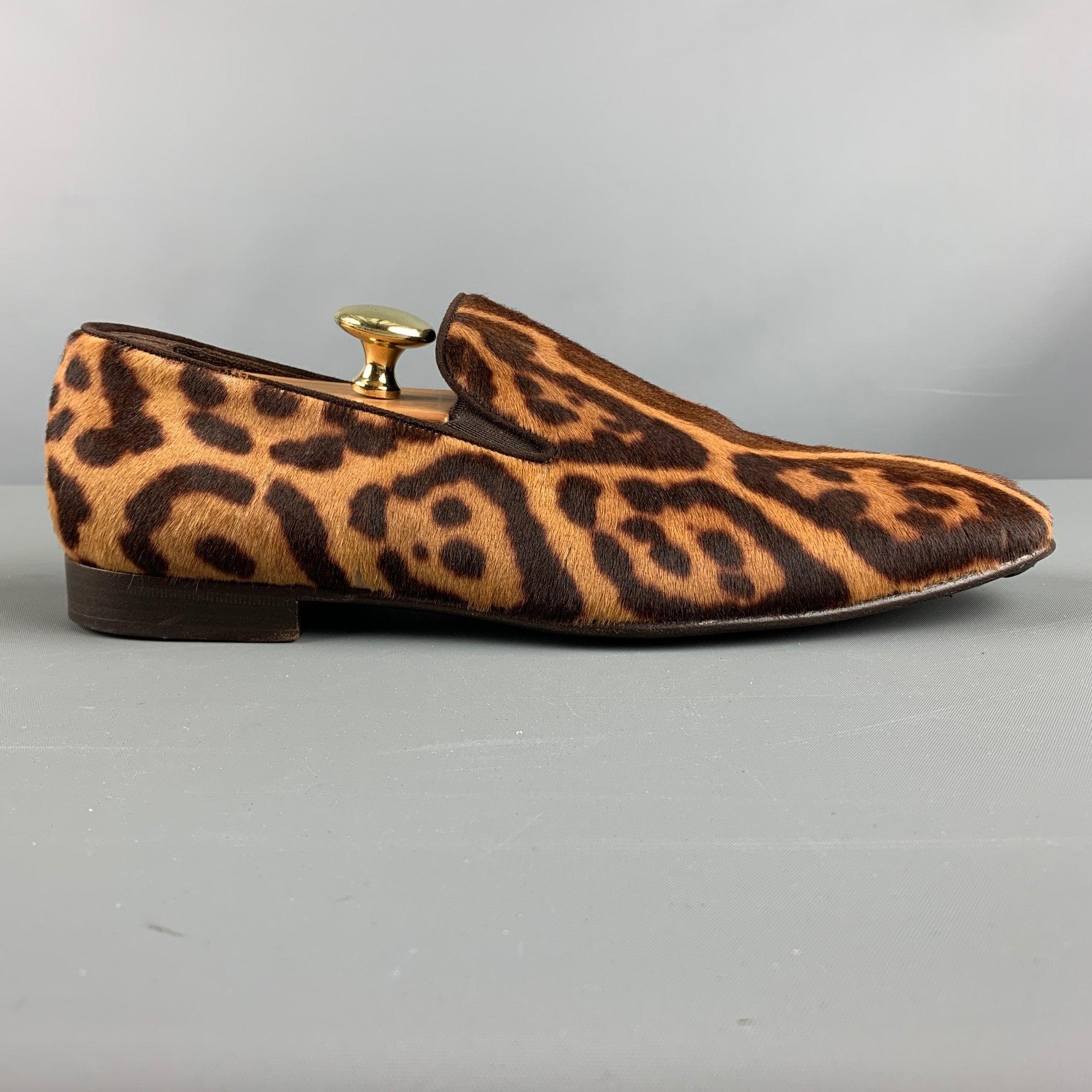 YVES SAINT LAURENT Rive Gauche loafers comes in a brown and tan leopard print leather featuring a slip on style. It does not includes shoe trees. Includes box. Made in Italy. Very Good Pre-Owned Condition. Signs of wear. Signs of wear. 

Marked:  