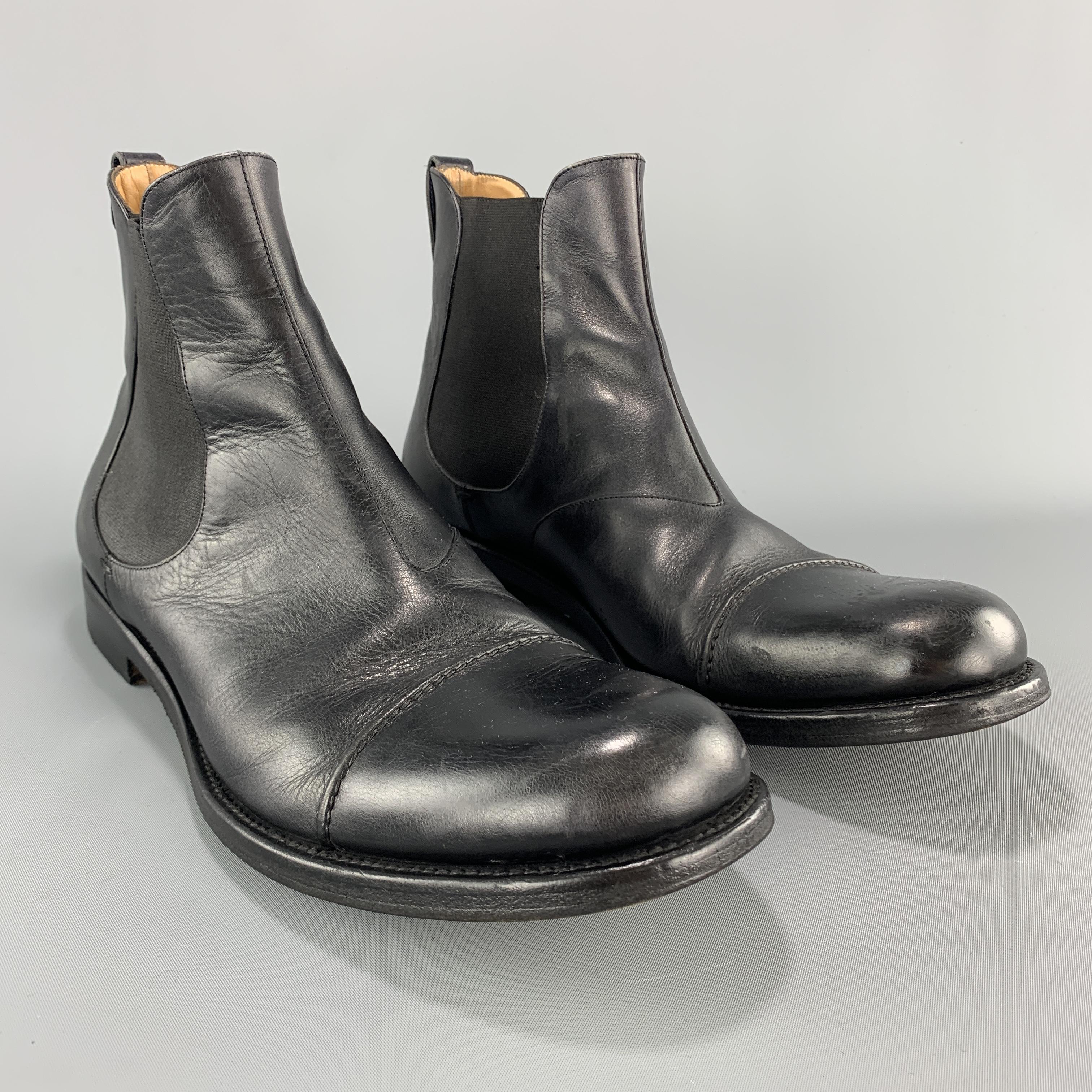 YVES SAINT LAURENT chelsea boots come in smooth black leather with elastic sides and toe cap. Made in Italy.

Very Good Pre-Owned Condition.
Marked: IT 42

Outsole: 12 x 4.5 in.