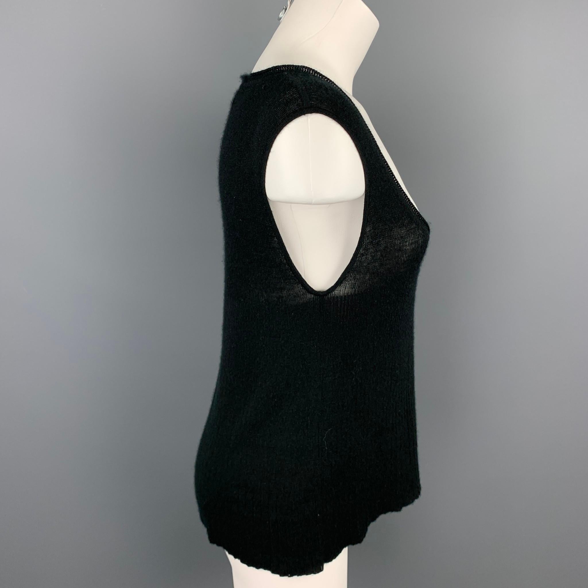 YVES SAINT LAUREN tank top comes in a black knitted cashmere featuring a scoop neck. As-Is. Made in Italy.

Good Pre-Owned Condition.
Marked: L

Measurements:

Shoulder: 16 in. 
Bust: 34 in. 
Length: 22.5 in. 