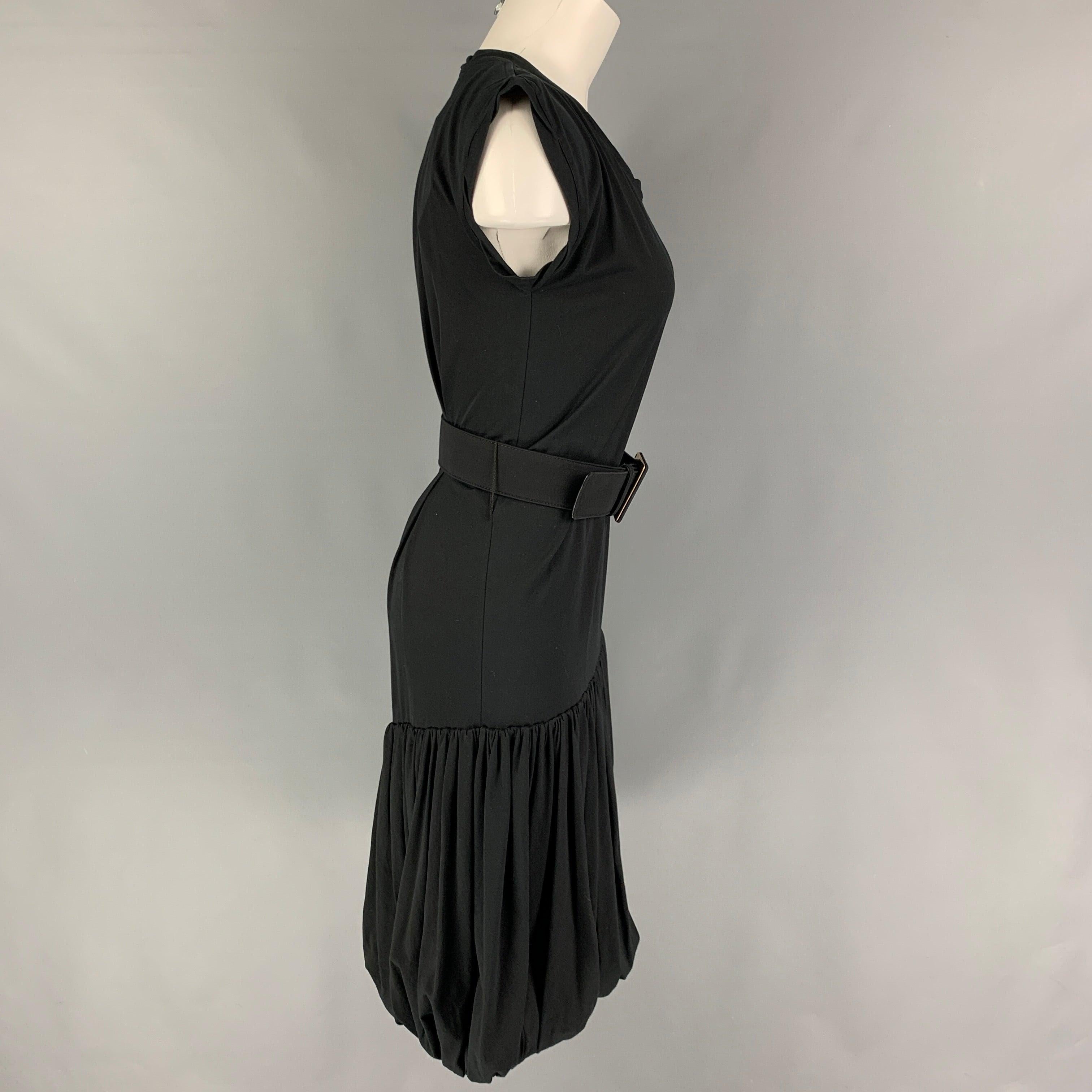 YVES SAINT LAURENT dress comes in a black cotton featuring a bubble hem, sleeveless, and a belt closure.
Very Good
Pre-Owned Condition. 

Marked:   S 

Measurements: 
 
Shoulder: 17.5 inches  Bust: 32 inches  Waist: 28 inches  Hip: 32 inches 