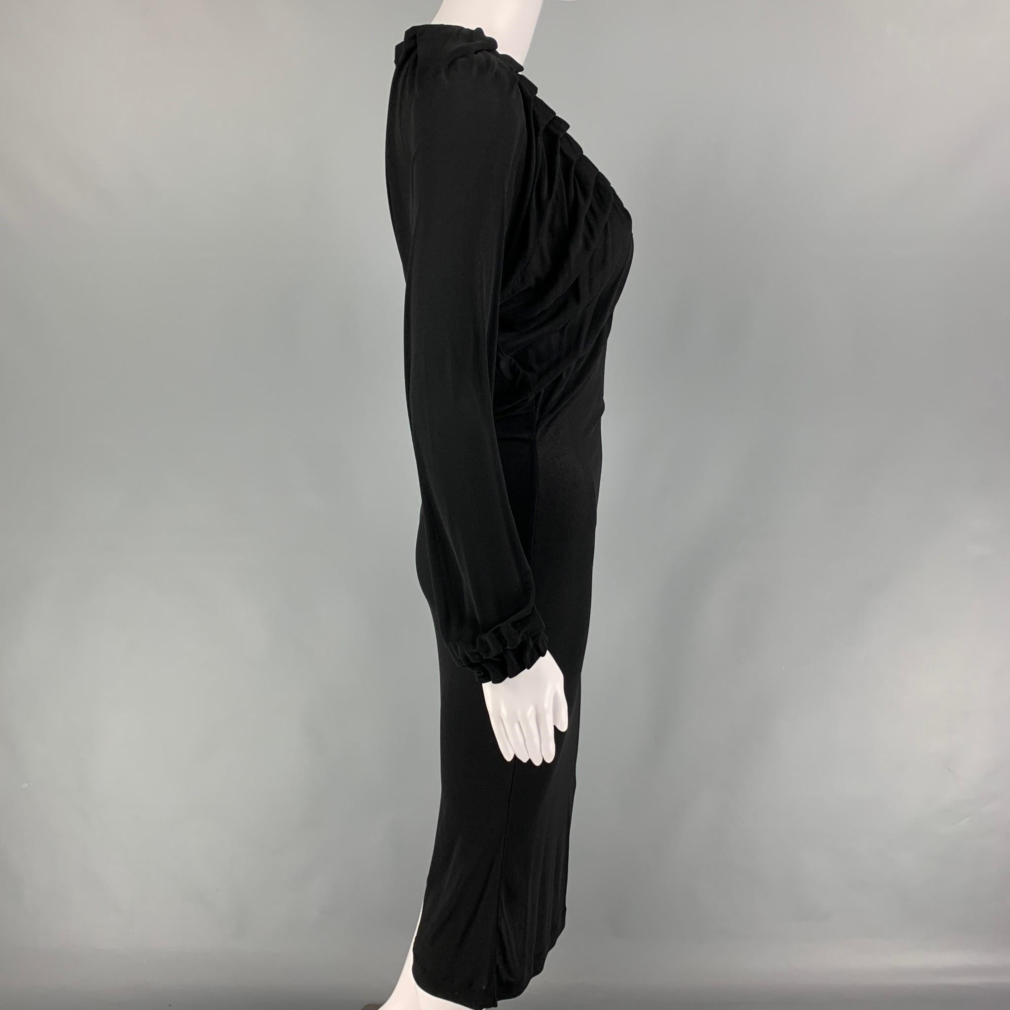 YVES SAINT LAURENT dress comes in a black stretch viscose featuring a pleated style, long sleeves, and a v-neck. Made in Italy. 

Very Good Pre-Owned Condition.
Marked: S

Measurements:

Shoulder: 14 in.
Bust: 28 in.
Waist: 22 in.
Hip: 30