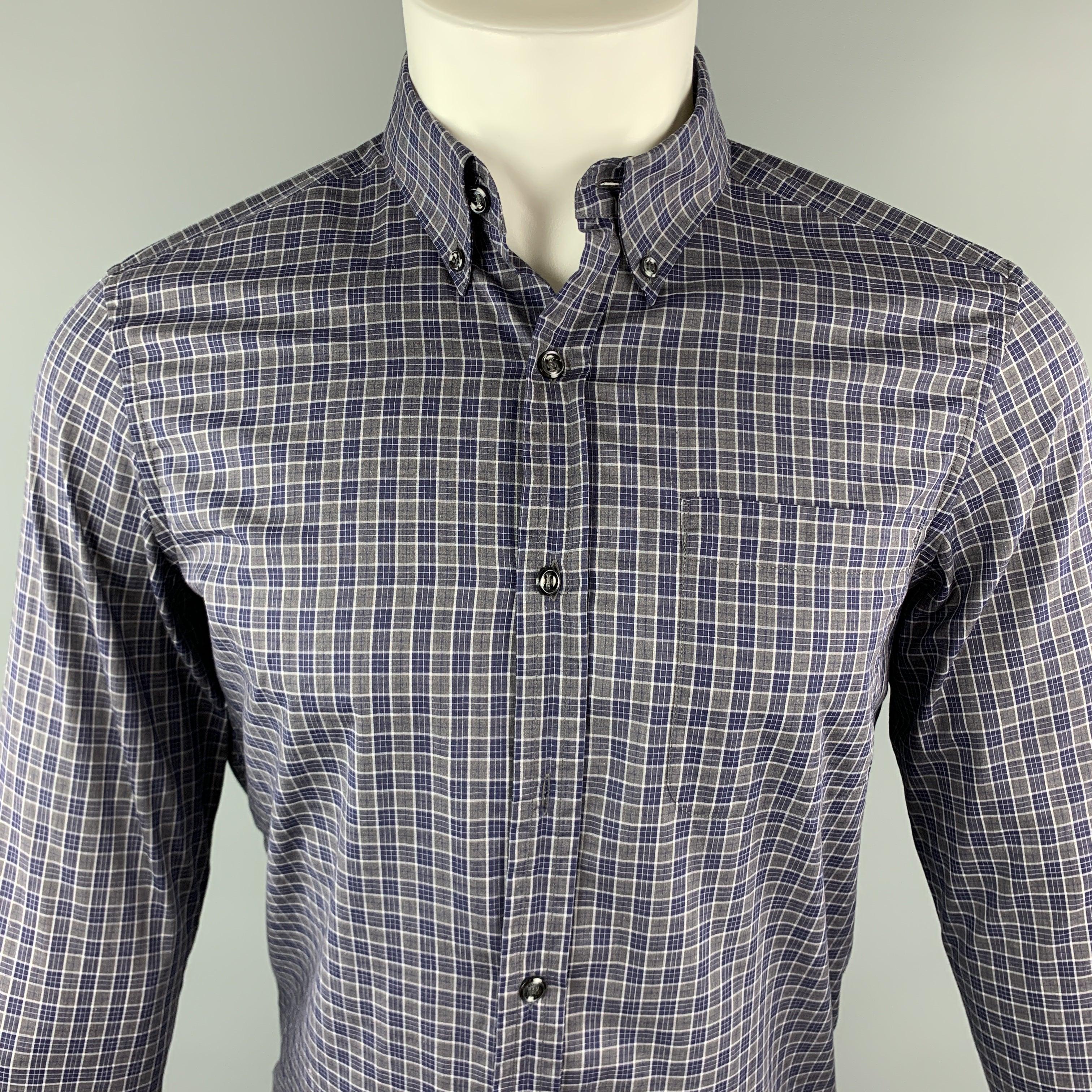 YVES SAINT LAURENT Long Sleeve Shirt comes in gray & navy plaid cotton featuring a button down style, spread collar, a front patch pocket and buttoned cuffs. Missing one button. Made in Italy.Very Good Pre-Owned Condition. 

Marked:   38 / 15