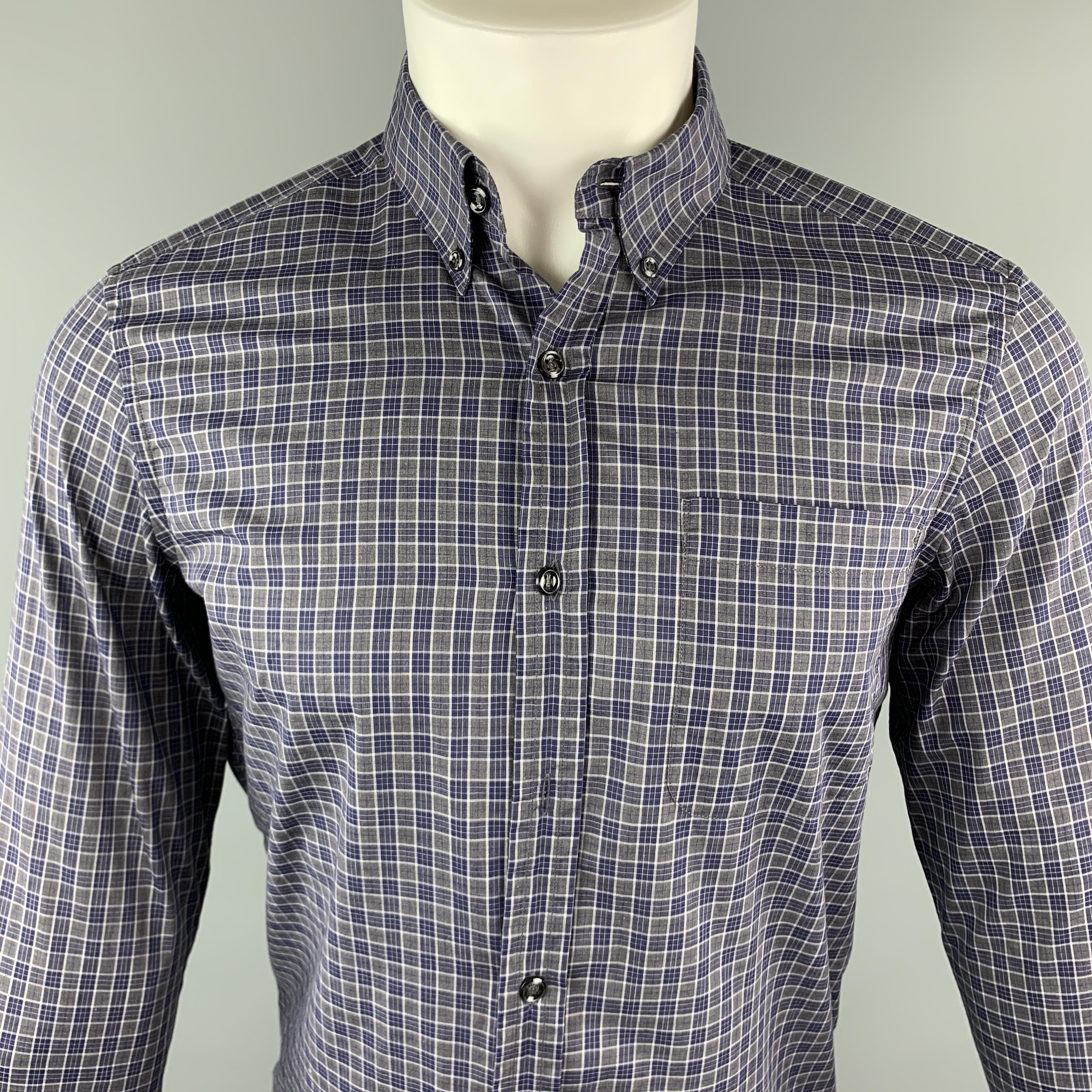 YVES SAINT LAURENT Long Sleeve Shirt comes in gray & navy plaid cotton featuring a button down style, spread collar, a front patch pocket and buttoned cuffs. Missing one button. Made in Italy.

Very Good Pre-Owned Condition.
Marked: 38 /