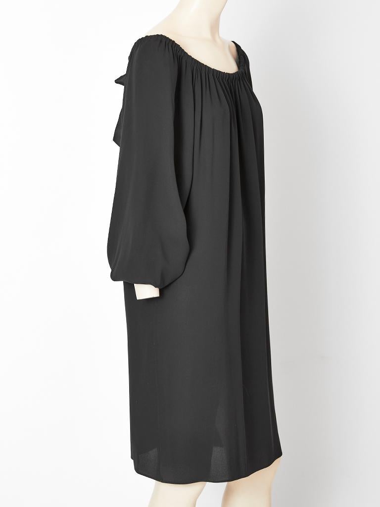Alber Elbaz, for Yves Saint Laurent, black chiffon smock dress, having bell sleeves and a draw string neckline finished with a satin bow detail.