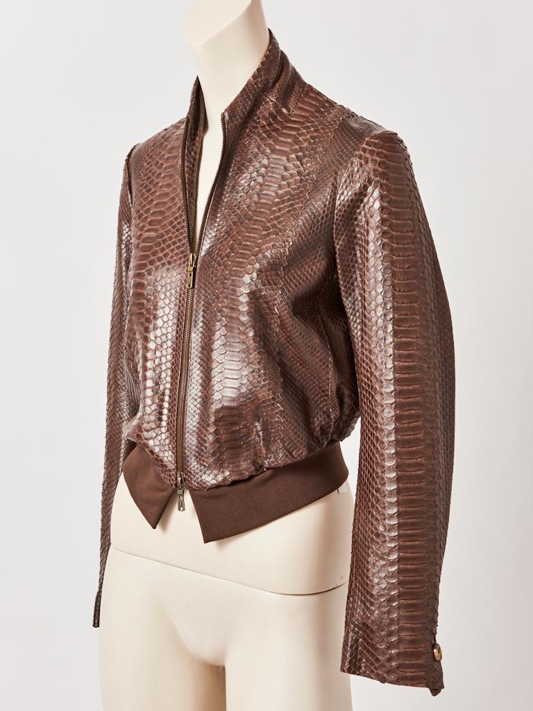 Tom Ford for Yves Saint Laurent, brown, snakeskin, bomber jacket, having a knit waist band and a button detail at the cuff, a mandarin, stand up collar and front zipper closure. 