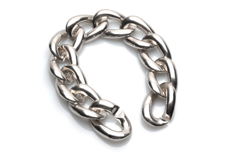 A fine and elegant sterling silver bracelet by Yves Saint Laurent. 

YSL's classic take on the link bracelet comes in the form of oversized links and a streamlined shape. 

Marked on interior link.