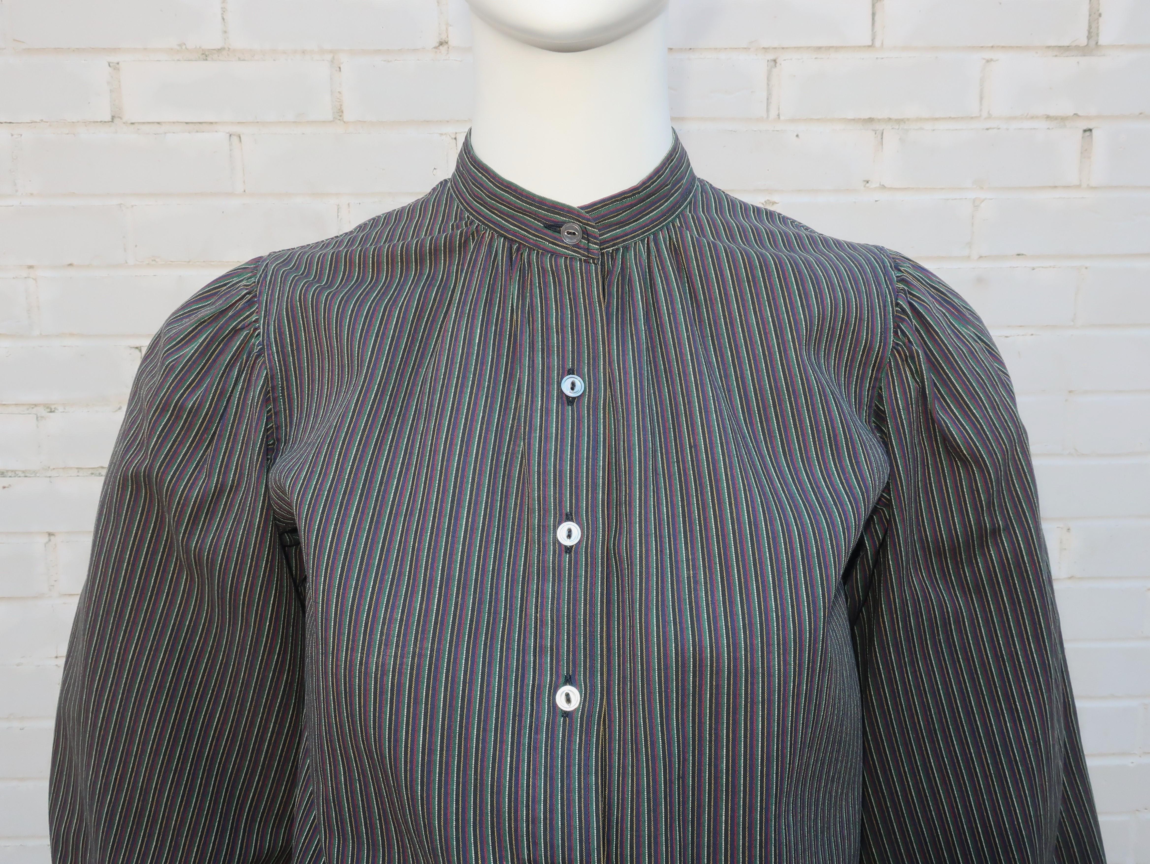 1970's Yves Saint Laurent Rive Gauche striped cotton blouse in a peasant style silhouette.  The fabric is reminiscent of cotton ticking with a relaxed feel in dark shades including black, gray, forest green, red, dark yellow and white.  The pullover