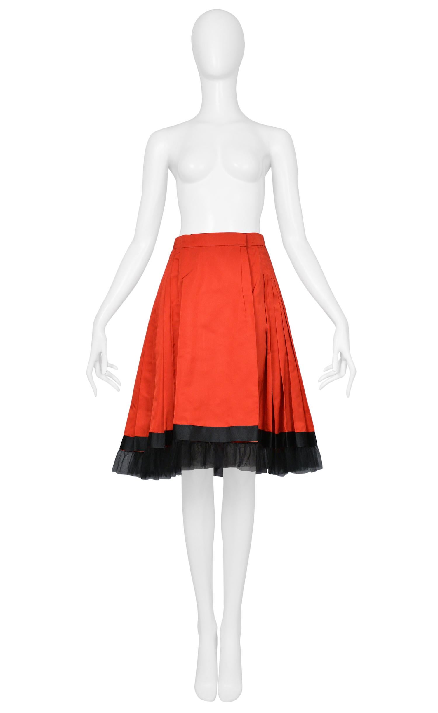 Vintage Yves Saint Laurent red taffeta pleated skirt featuring black ribbon and gathered tulle along the hem.
