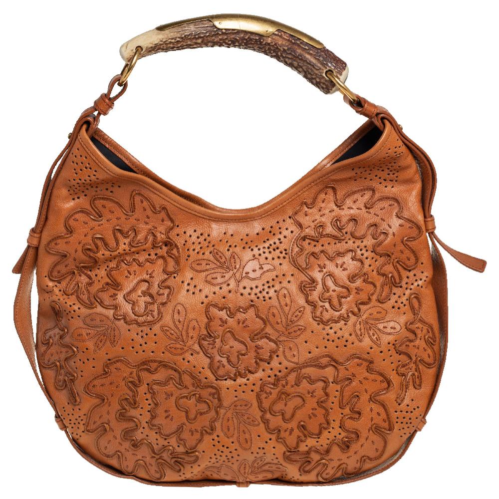 It is indeed rare for one to chance upon a hobo as gorgeous as this one from Yves Saint Laurent. It comes beautifully crafted from embroidered leather and designed with a horn handle and gold-tone hardware. The bag also brings a satin-lined interior