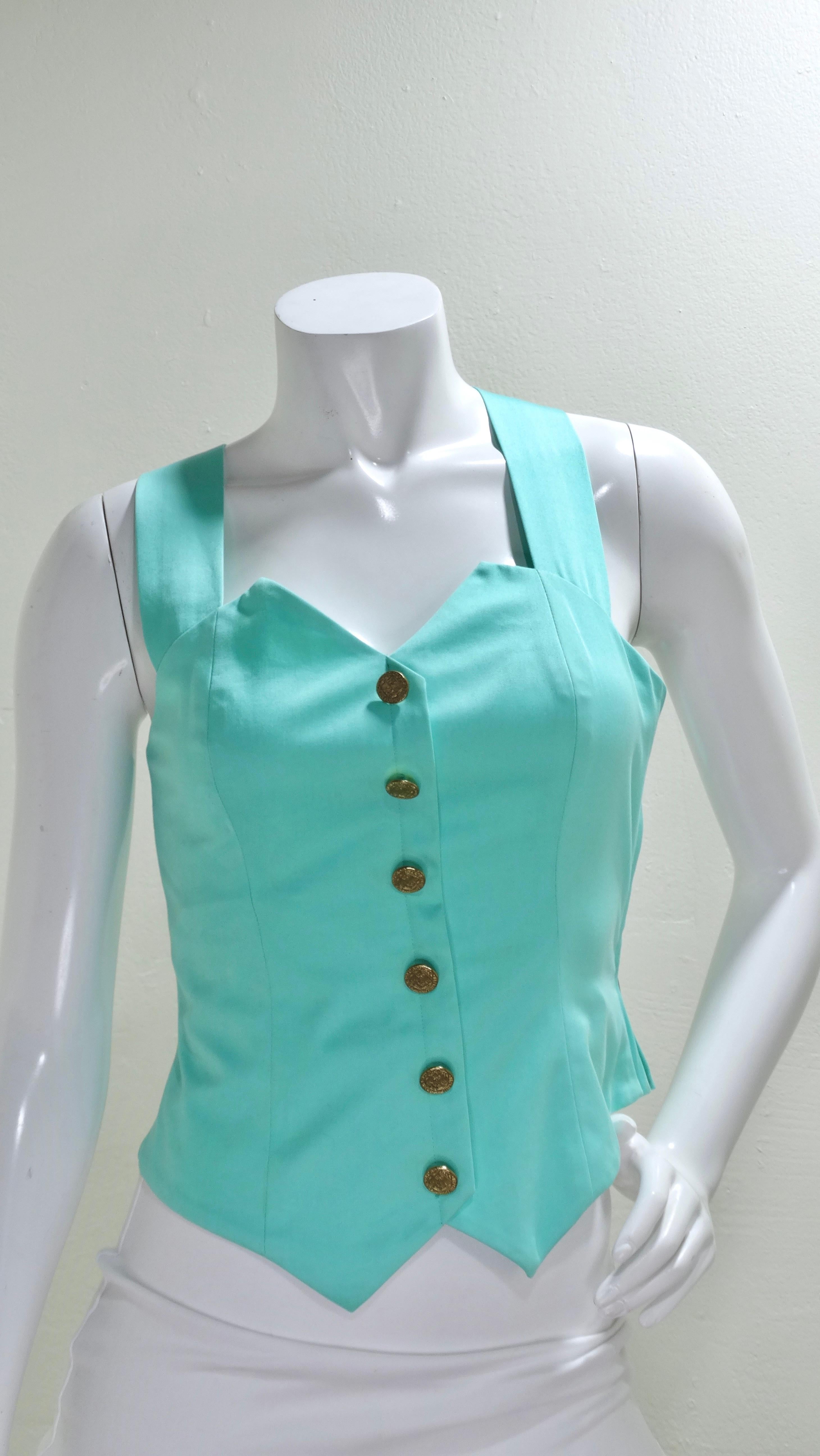 A 1990's Yves Saint Laurent gem! Bustiers are never going to go out of style and never fail to make you feel your very best. This bustier is not lined, features six intricate buttons lining the front, crossover straps, and a zip-closure. Pair with a