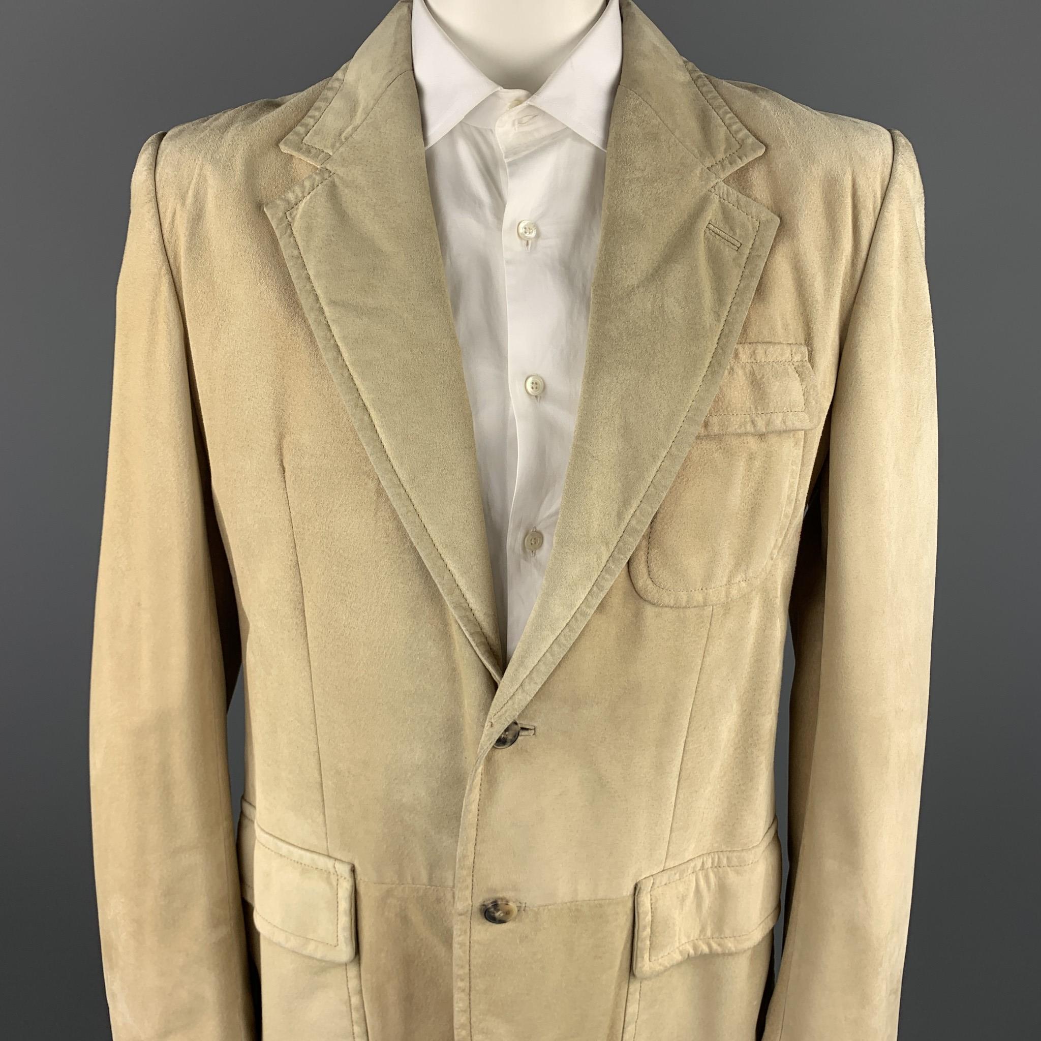 YVES SAINT LAURENT Rive Gauche by Tom Ford blazer jacket comes in a thick natural suede featuring a notch lapel, flap pockets, and a two button closure. Made in Italy.

Fair Pre-Owned Condition.
Marked: IT 52

Measurements:

Shoulder: 19 in. 
Chest:
