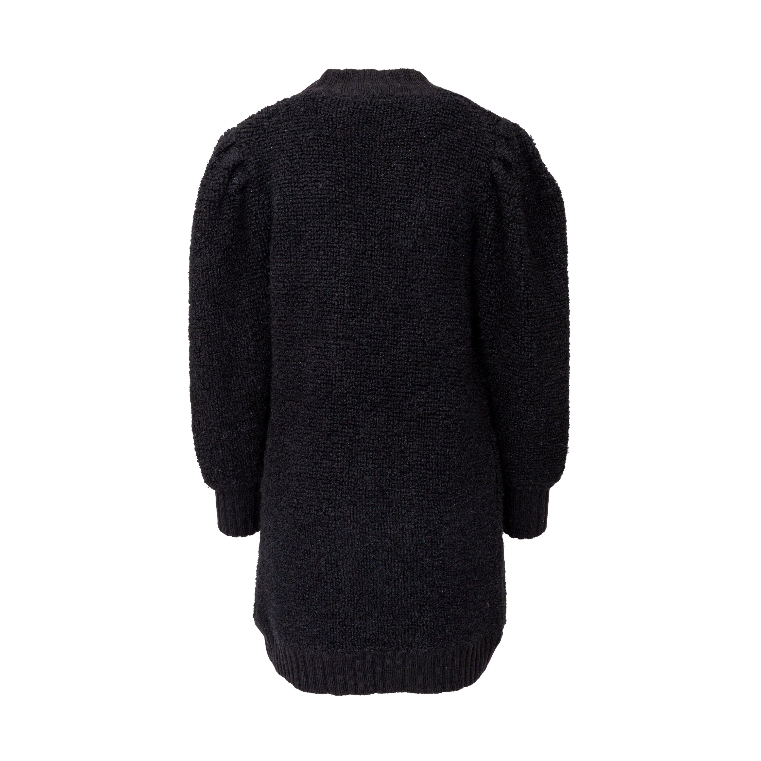 This Yves Saint Laurent cardigan from the tricot label offers a long silhouette and cozy, warm fit in terry knitted wool. The black, open front design is accented with ribbed hem and front borders. Puffed sleeves add a touch of playfulness.

