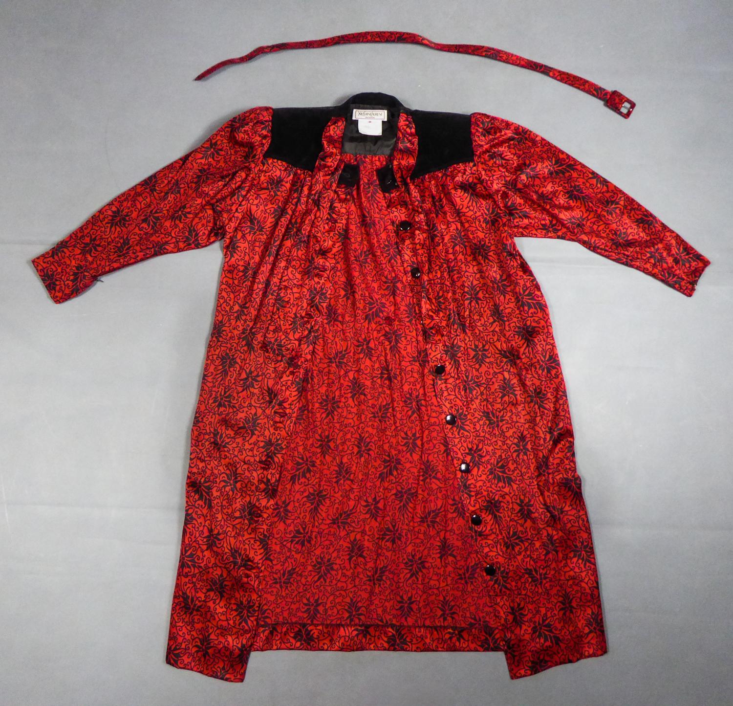Circa 1990
France

Iconic blouse dress in printed silk satin from the Variation line by Yves Saint Laurent and dating from the 1990s. Beautiful silk satin printed with stylized patterns in illuminations probably from the designer house Staron in