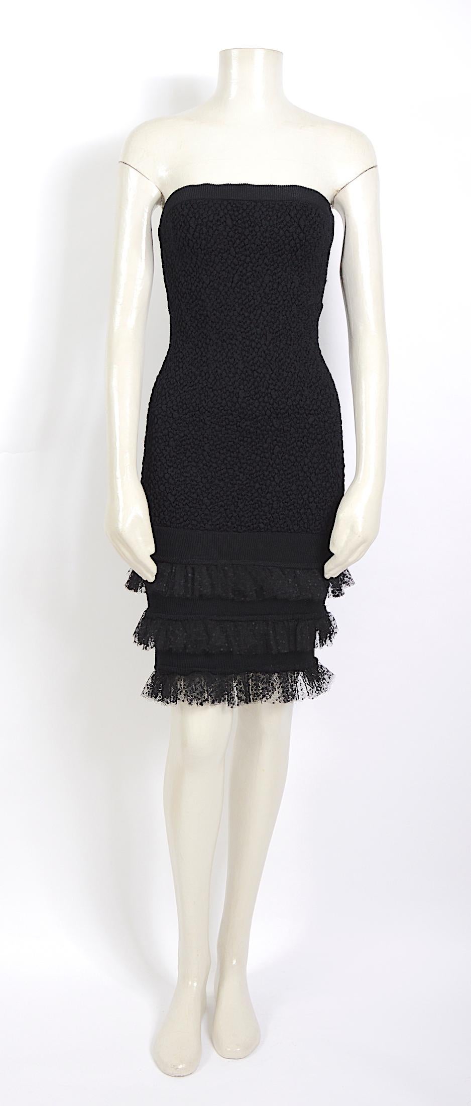 
Yves Saint Laurent's original 1980s version of the tulle trimmed dress available in the Saint Laurent Fall 2019 collection.
The strapless bustier dress comes with a matching bolero.
In good vintage condition. 
Dress and bolero French size 40 but