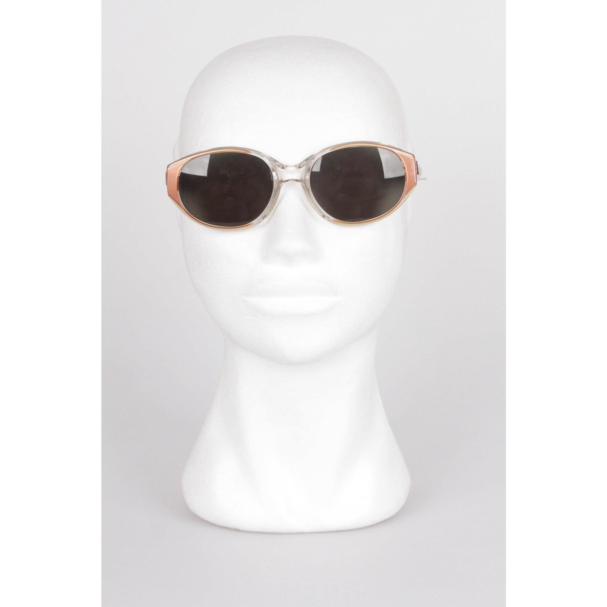 - Vintage sunglasses by YVES SAINT LAURENT from the 80s - Oval design - Mod. ARGOS 56/18 - 145 - 796 - Tan & Clear plastic frame - Gold metal YSL logo on temples - Mint green lenses - 100% UV protection Any other detail which is not mentioned may be