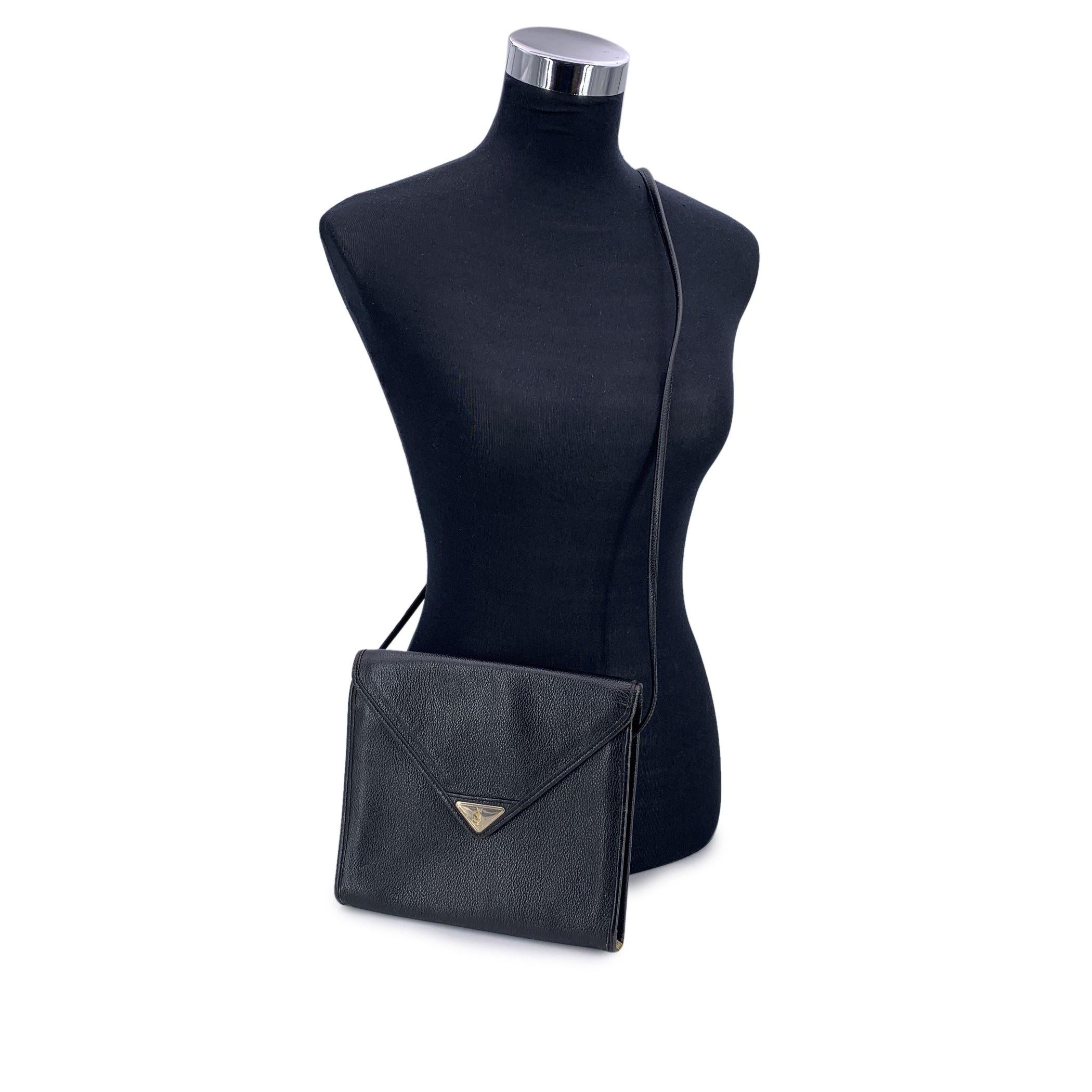 There's a certain kind of elegance that only vintage Yves Saint Laurent can deliver - bold yet refined, and unmistakably Parisian. This vintage YSL black leather flap shoulder bag is a shining example of that timeless allure. Crafted in supple black