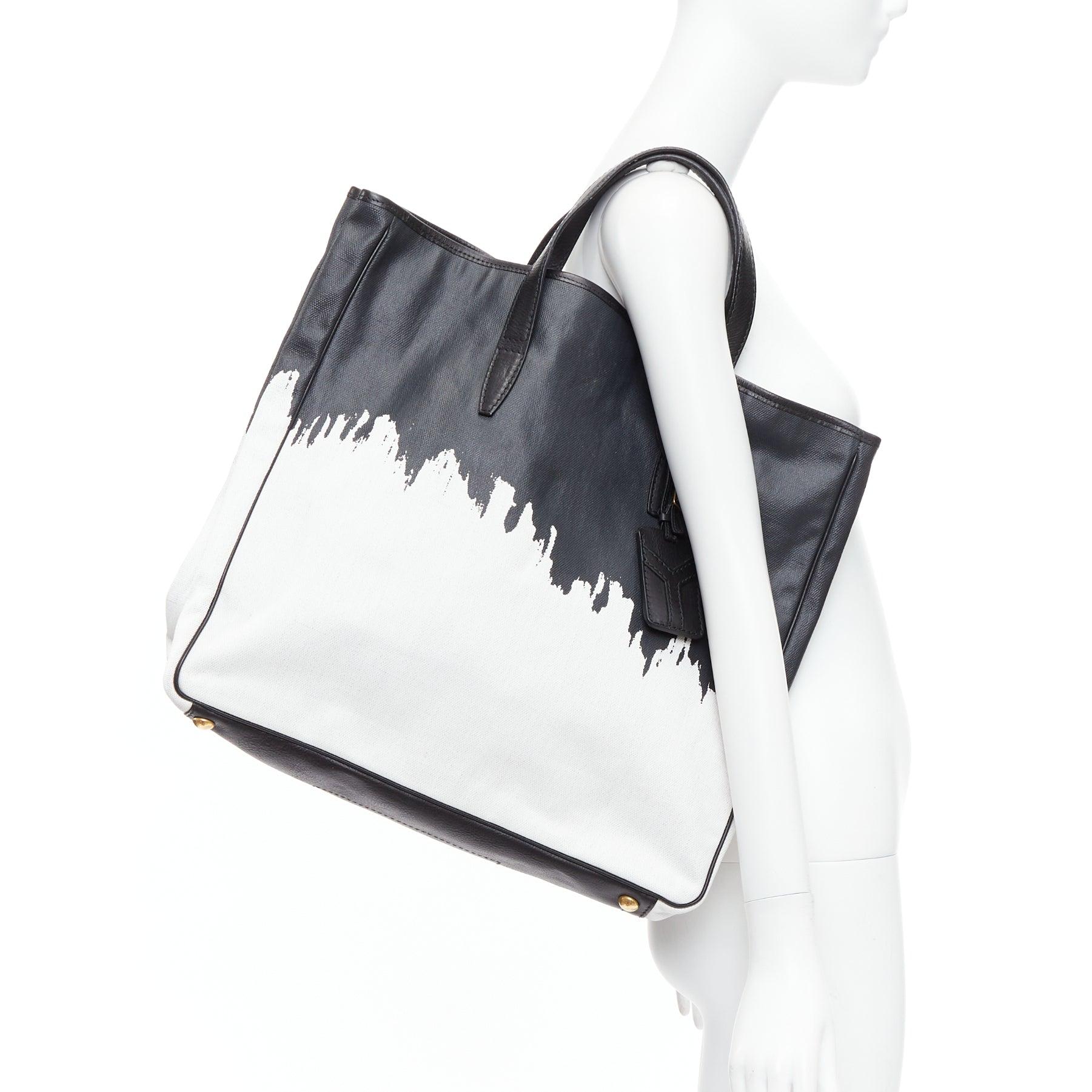 YVES SAINT LAURENT Bolso tote Y vintage de lona Raspail Cascade blanco negro
Referencia: PYCN/A00114
Marca: Yves Saint Laurent
Model No: Raspail Cascada
Material: Lona, cuero
Color: Negro, Blanco
Patrón: Sólido
Cierre: Imán
Forro: Lona