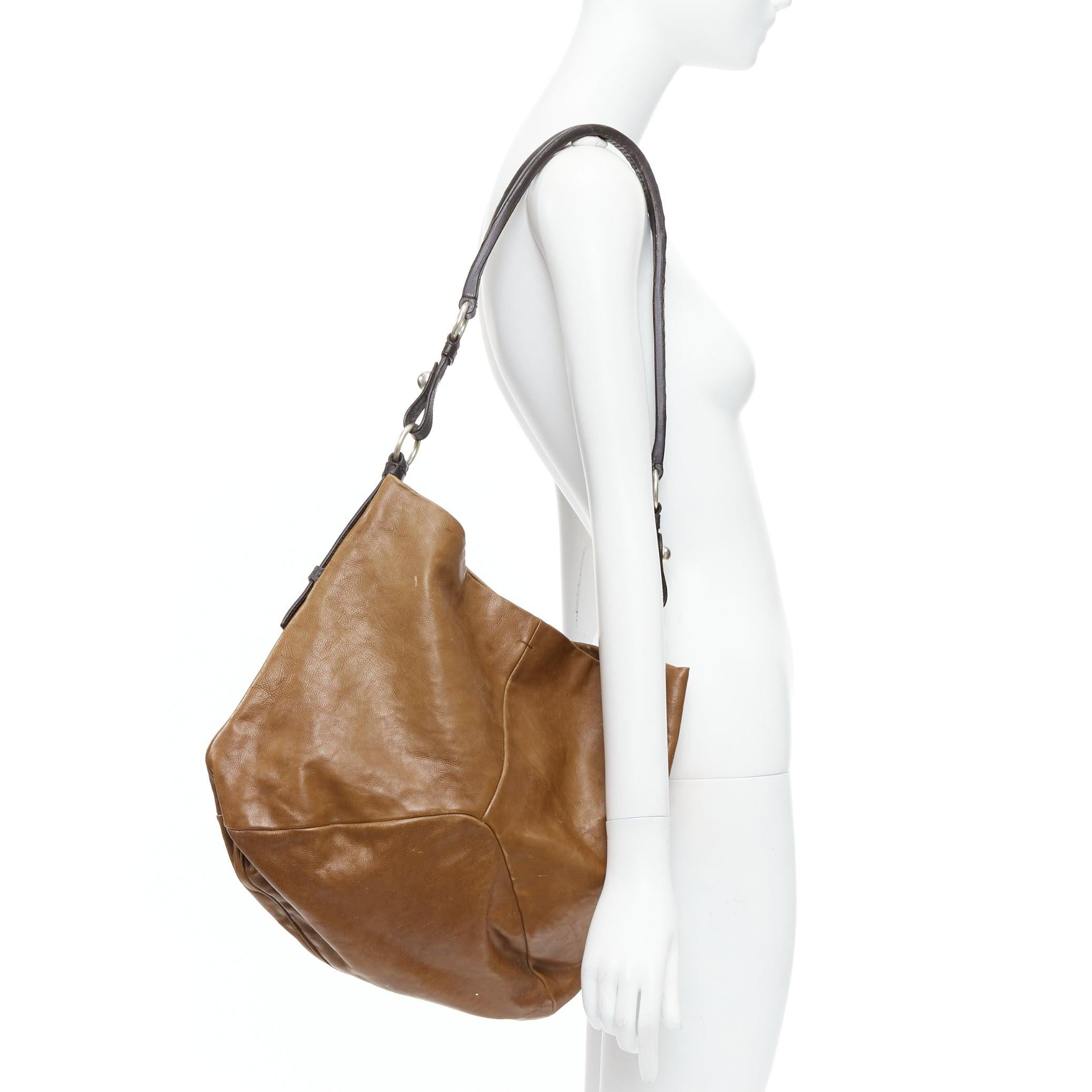 YVES SAINT LAURENT Vintage brown leather silver rings shoulder hobo bag
Reference: PYCN/A00109
Brand: Yves Saint Laurent
Material: Leather
Color: Brown, Silver
Pattern: Solid
Closure: Magnet
Lining: Brown Leather
Made in: