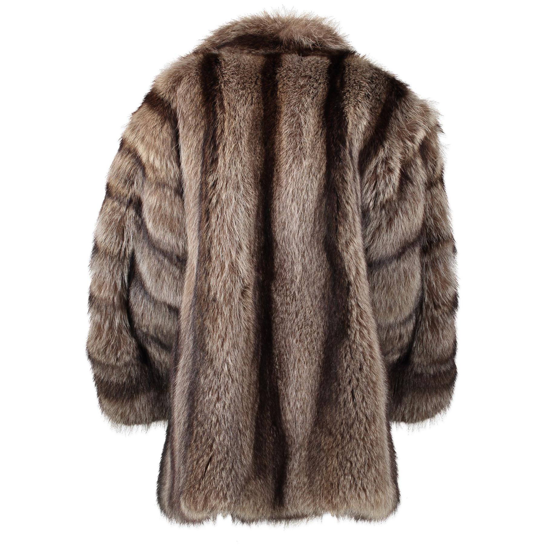 Yves Saint Laurent is known for their haute couture and influencial designs.
This vintage raccoon fur jacket features a stand up collar and long sleeves. 
The jacket combines a vintage touch with the right amount of coolness.


